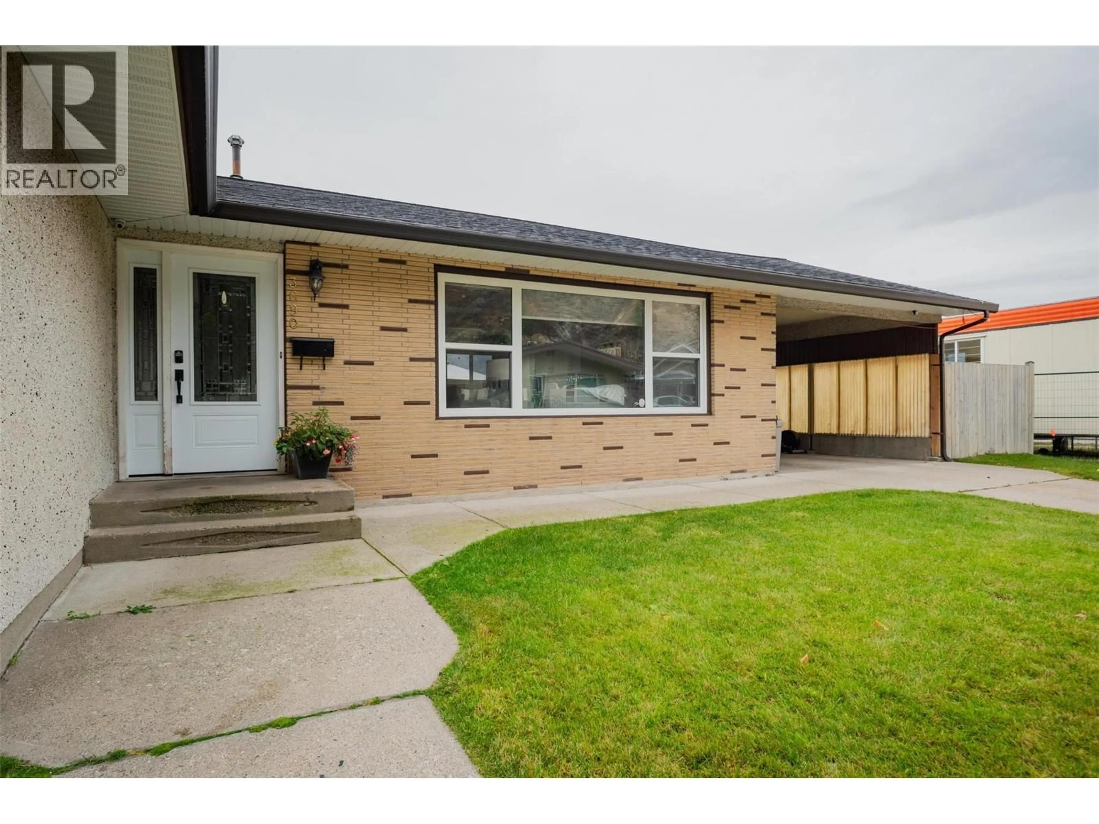 Home with brick exterior material, street for 3690 CARNATION DRIVE, Trail British Columbia V1R2W6