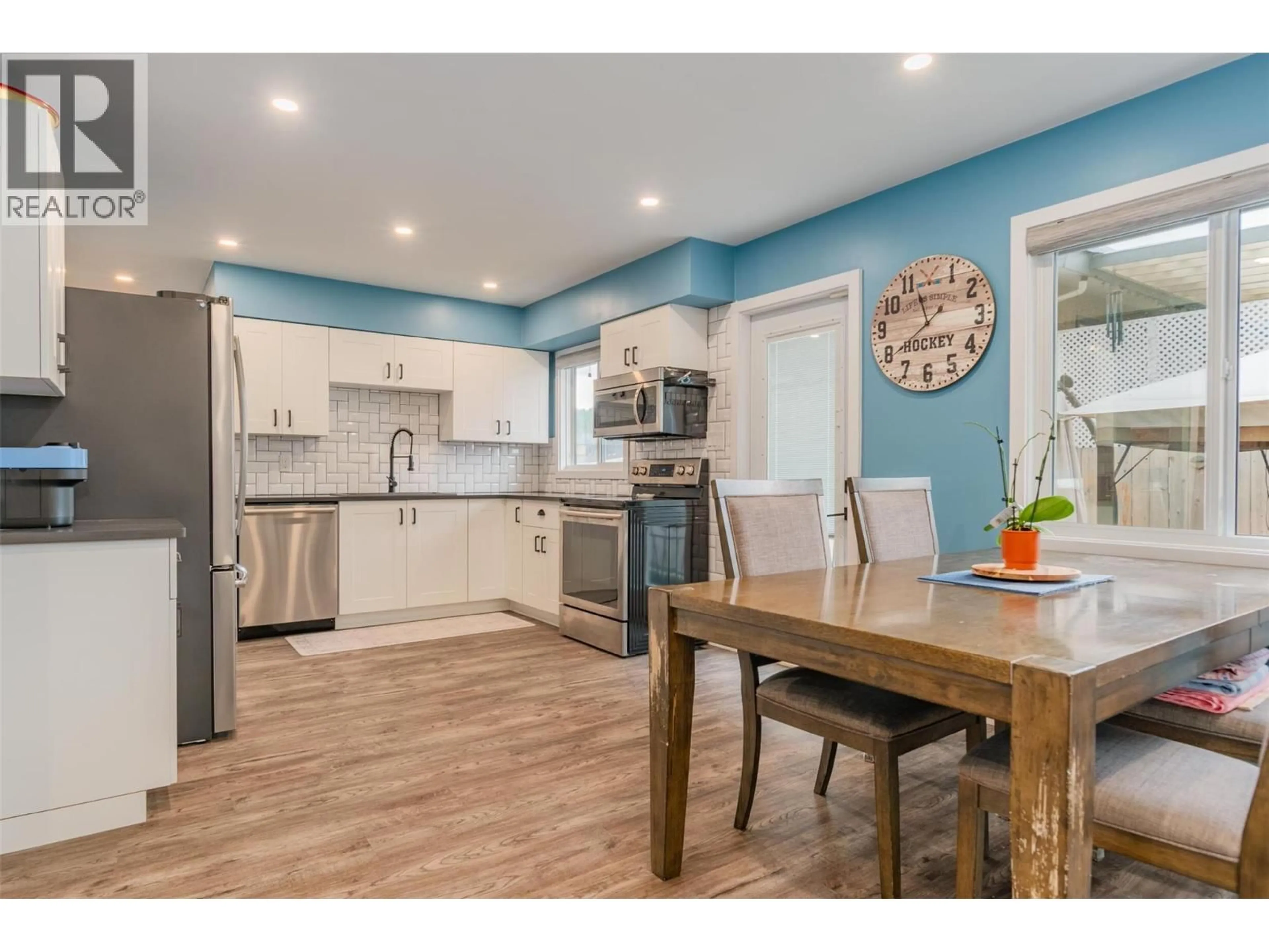 Open concept kitchen, wood/laminate floor for 3690 CARNATION DRIVE, Trail British Columbia V1R2W6