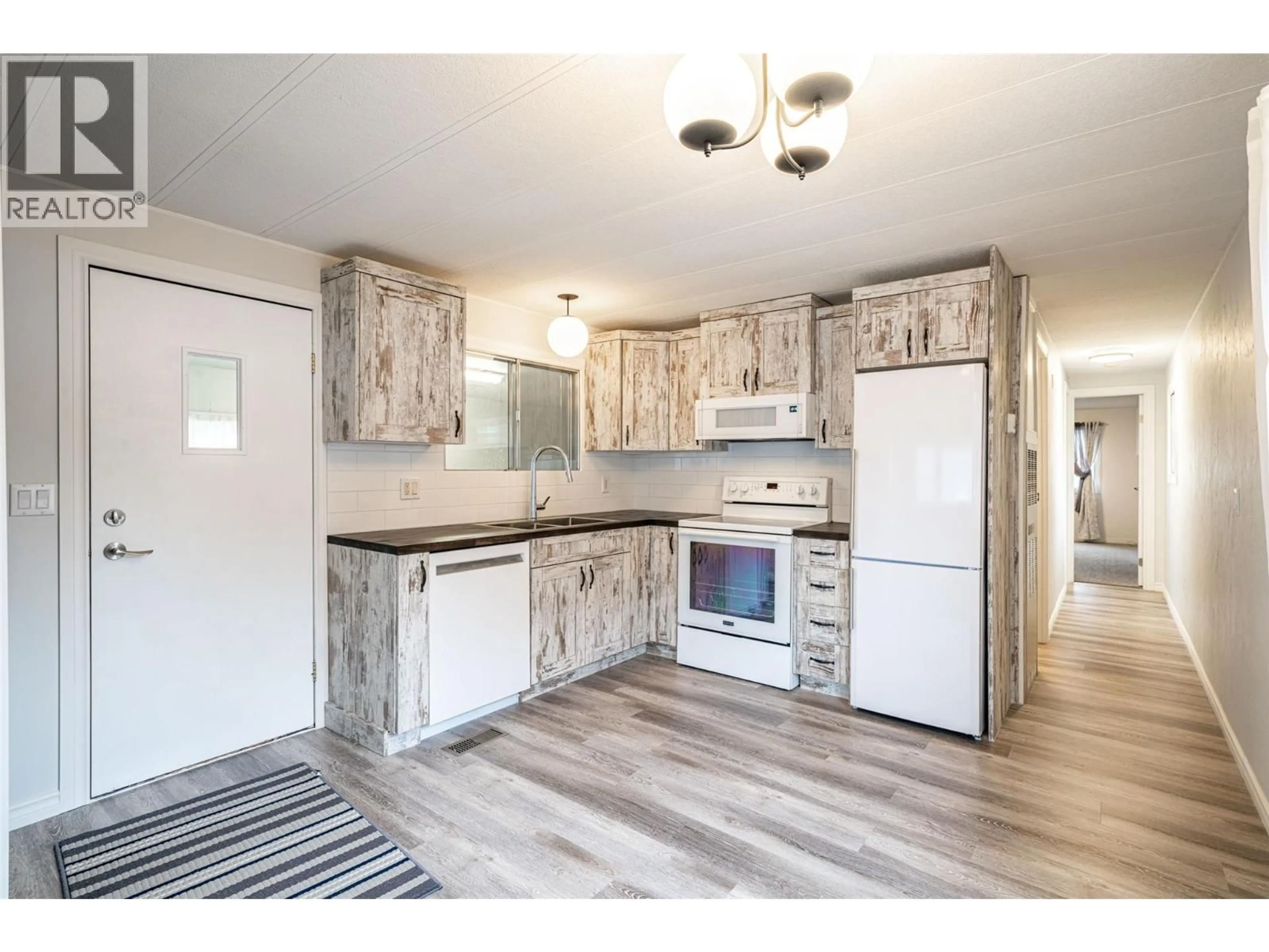 Open concept kitchen, unknown for E14 - 4505 MCLEAN CREEK ROAD, Okanagan Falls British Columbia V0H1R1