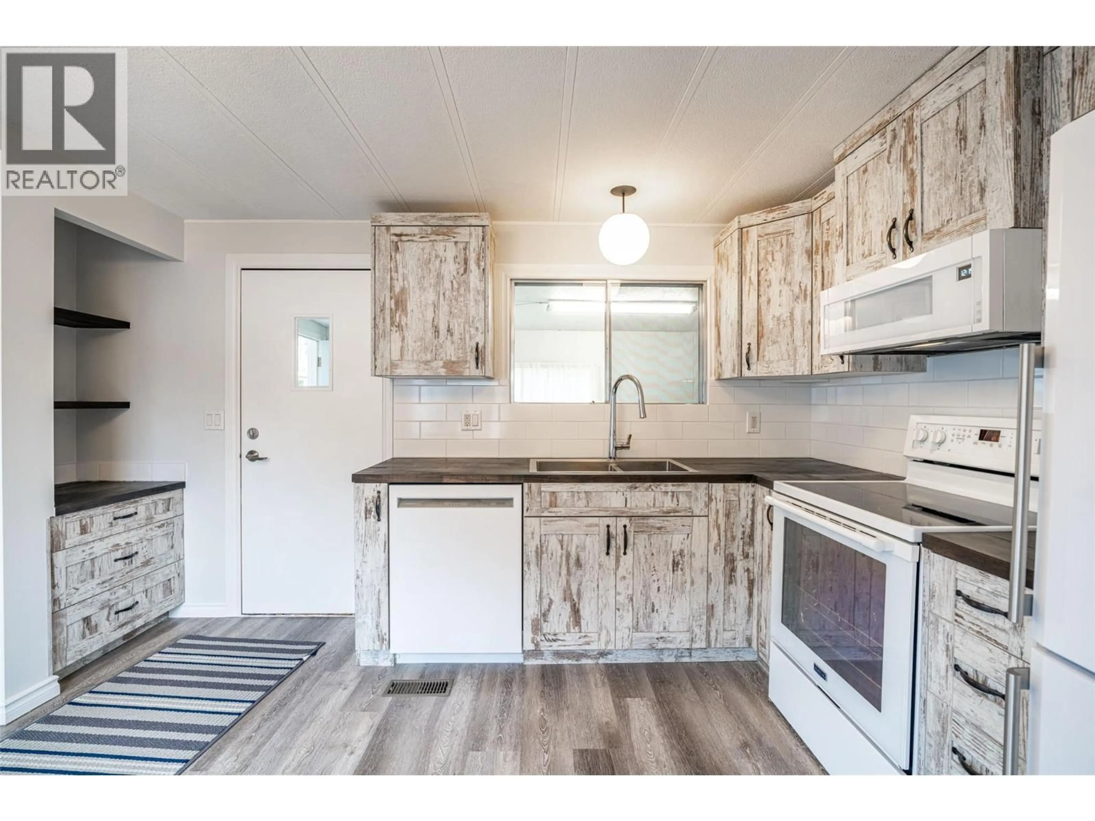 Open concept kitchen, unknown for E14 - 4505 MCLEAN CREEK ROAD, Okanagan Falls British Columbia V0H1R1