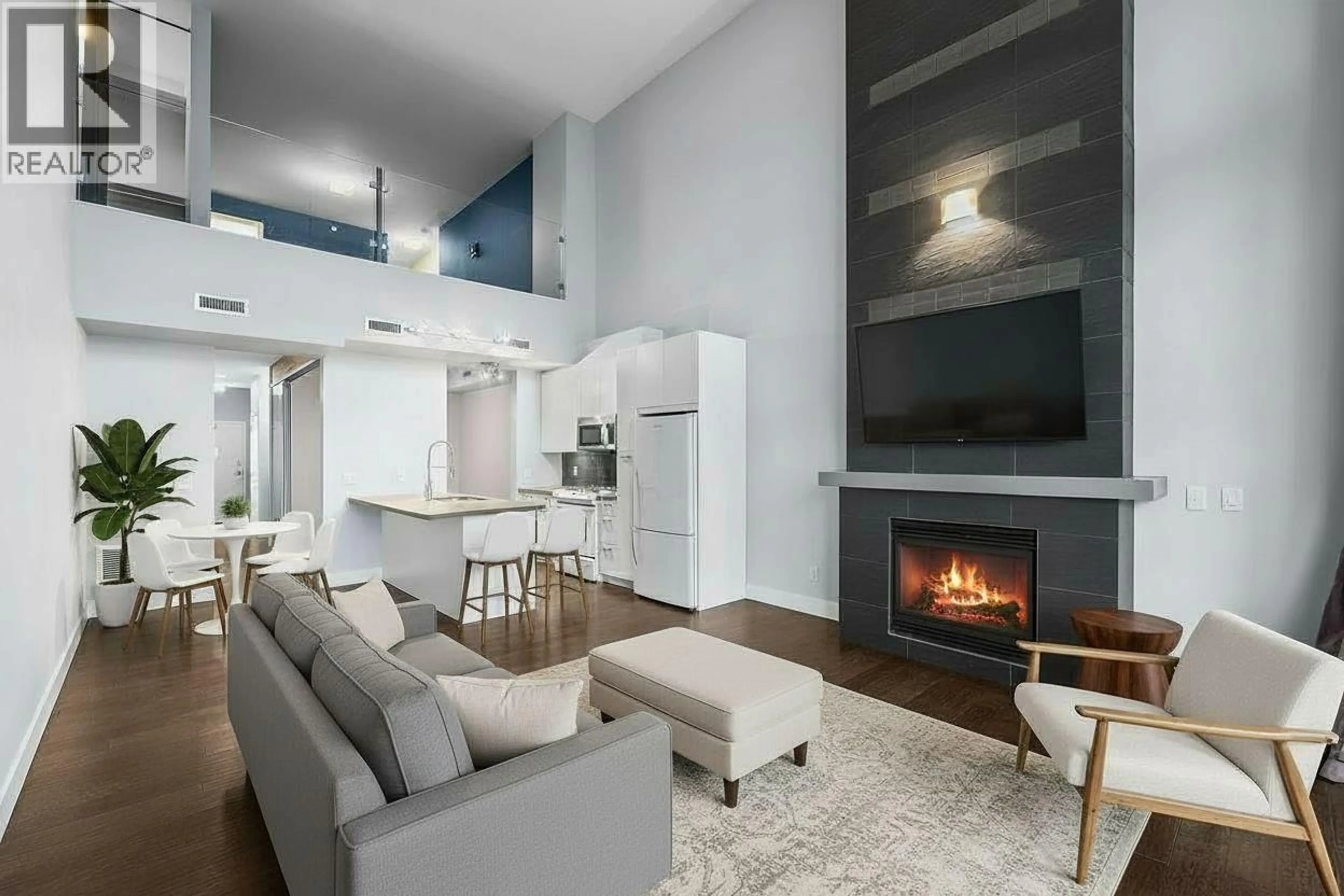 Living room with furniture, unknown for 411 - 1289 ELLIS STREET, Kelowna British Columbia V1Y9X6