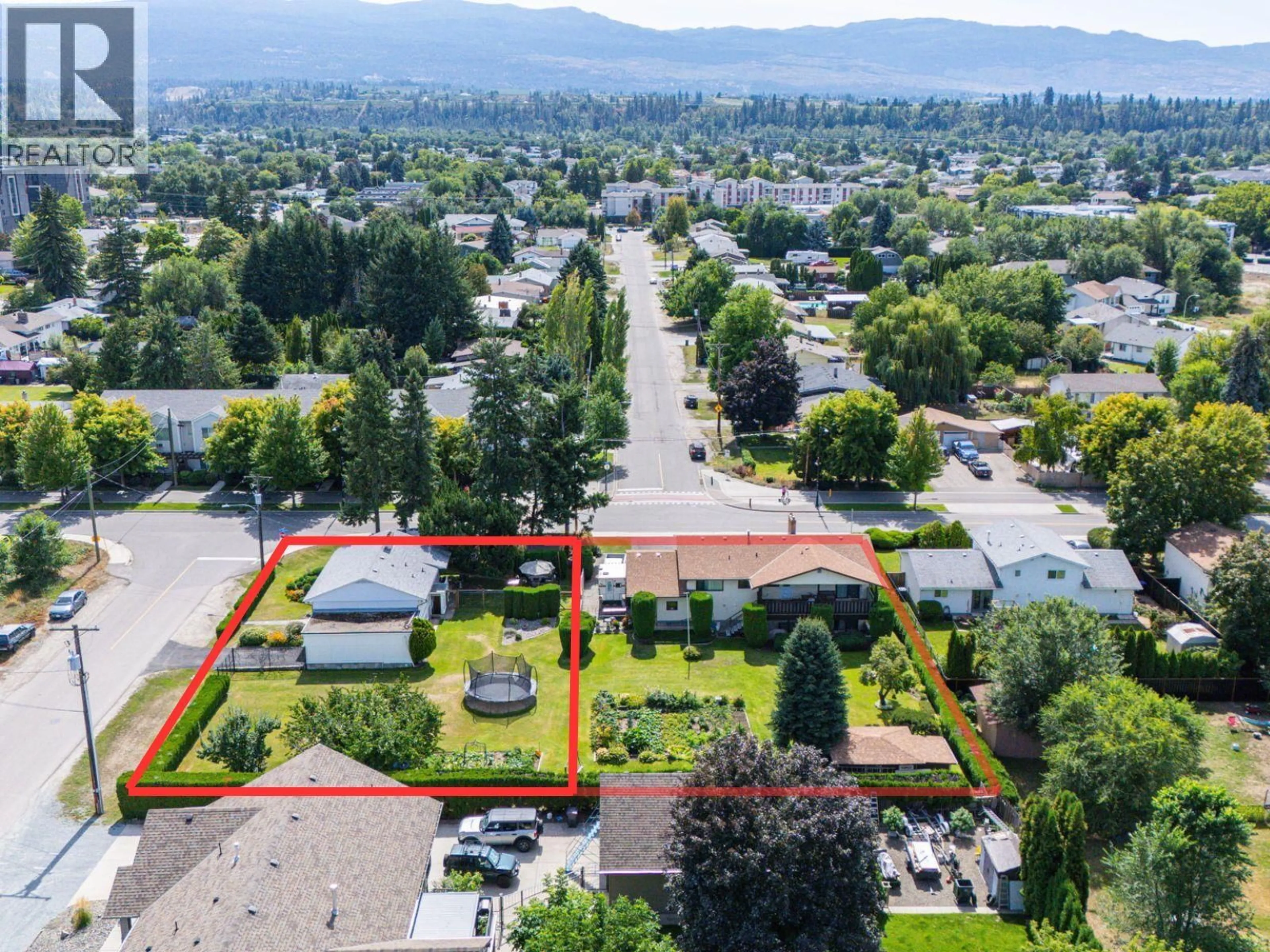 A pic from outside/outdoor area/front of a property/back of a property/a pic from drone, mountain view for 350 FLEMING ROAD, Kelowna British Columbia V1X3Z3