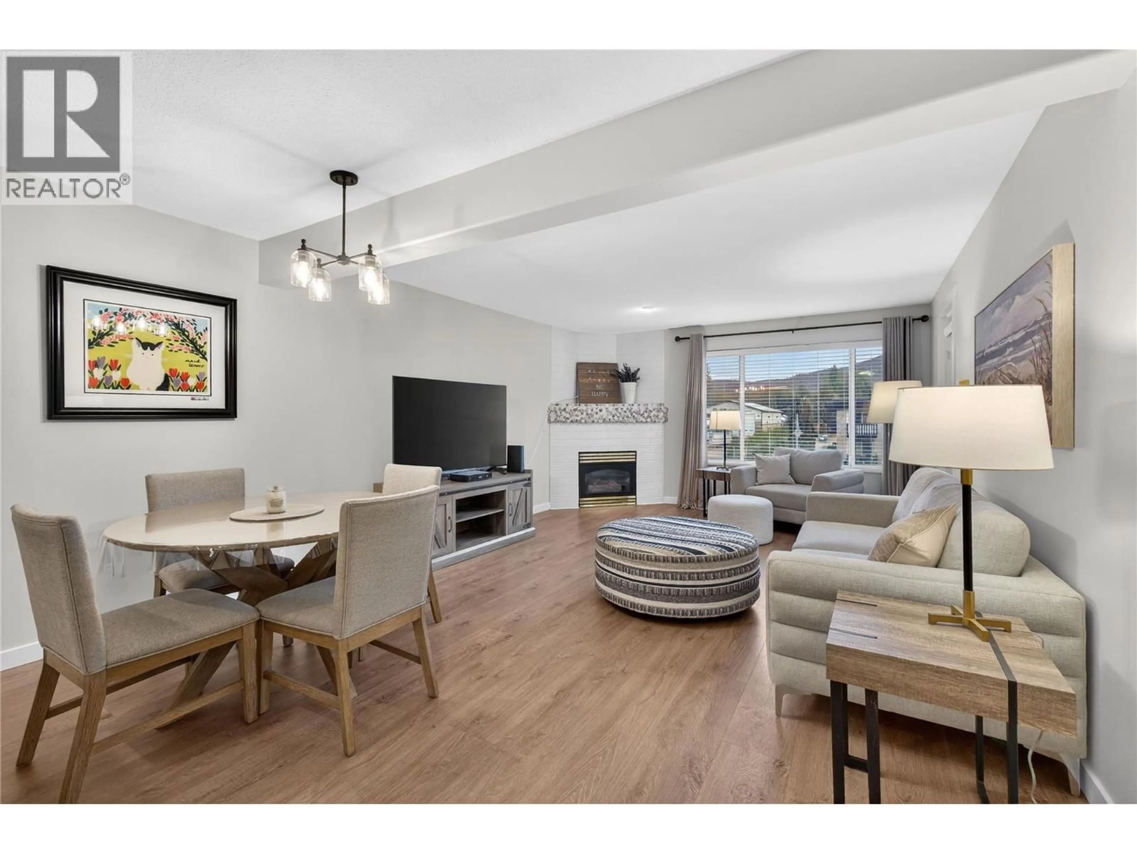 Living room with furniture, wood/laminate floor for 206 - 1002 RIVERSIDE AVENUE, Sicamous British Columbia V0E2V0