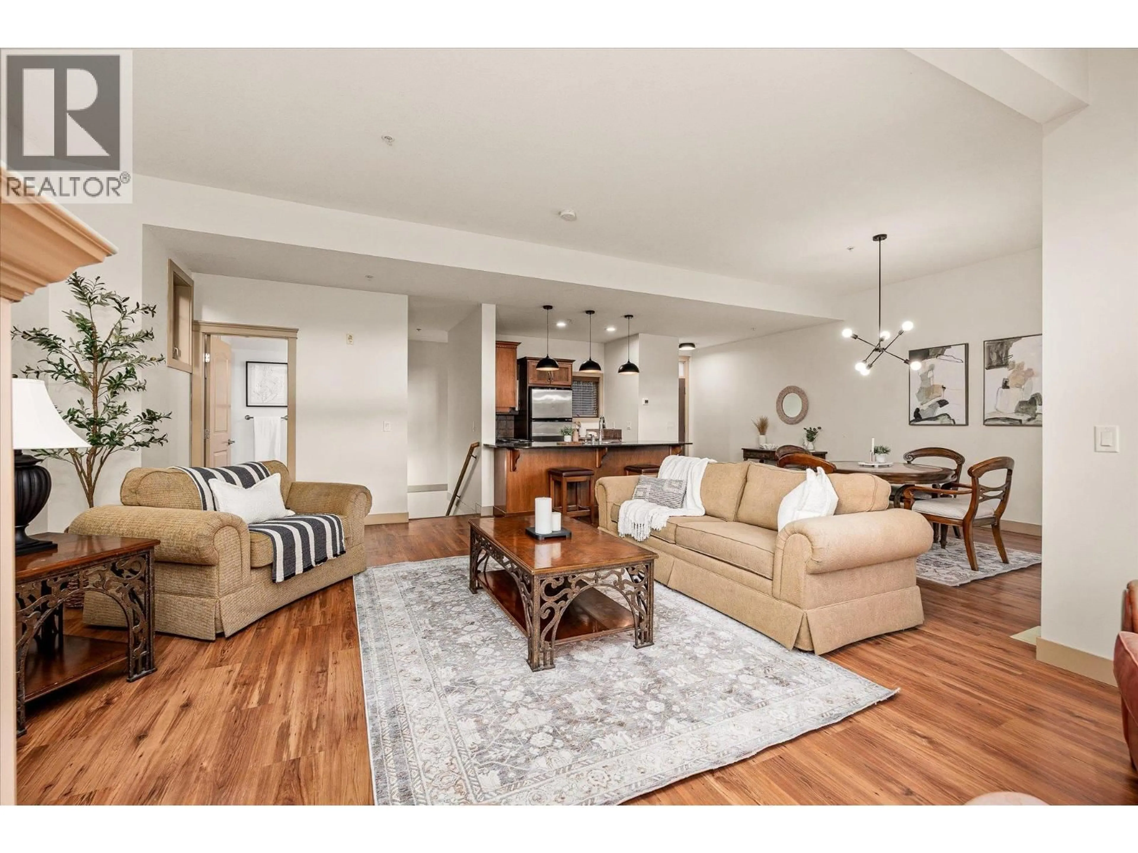 Living room with furniture, wood/laminate floor for 126 - 1795 COUNTRY CLUB DRIVE, Kelowna British Columbia V1V2V9