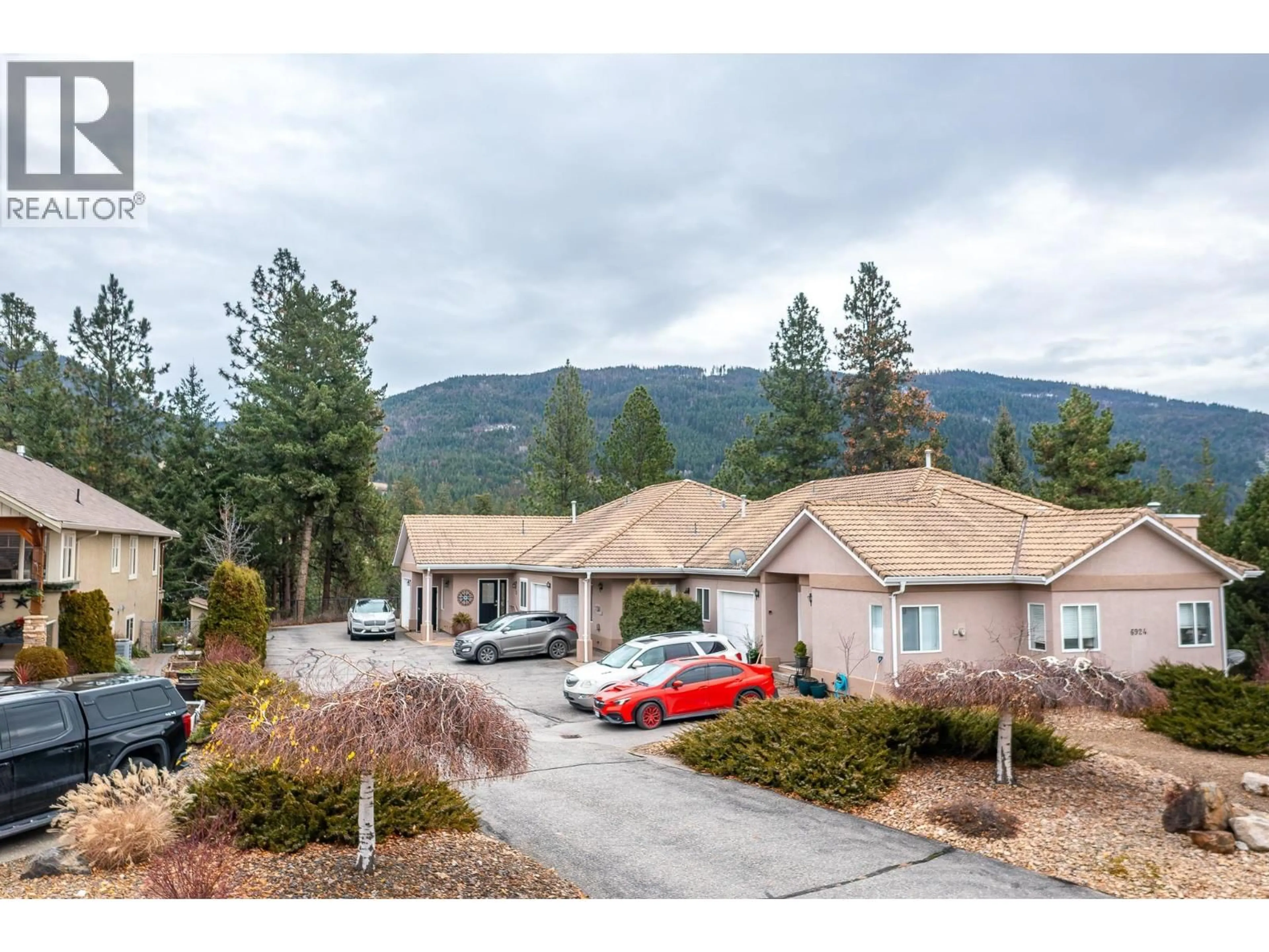 A pic from outside/outdoor area/front of a property/back of a property/a pic from drone, mountain view for 3 - 6924 MANNING PLACE, Vernon British Columbia V1B2Y5