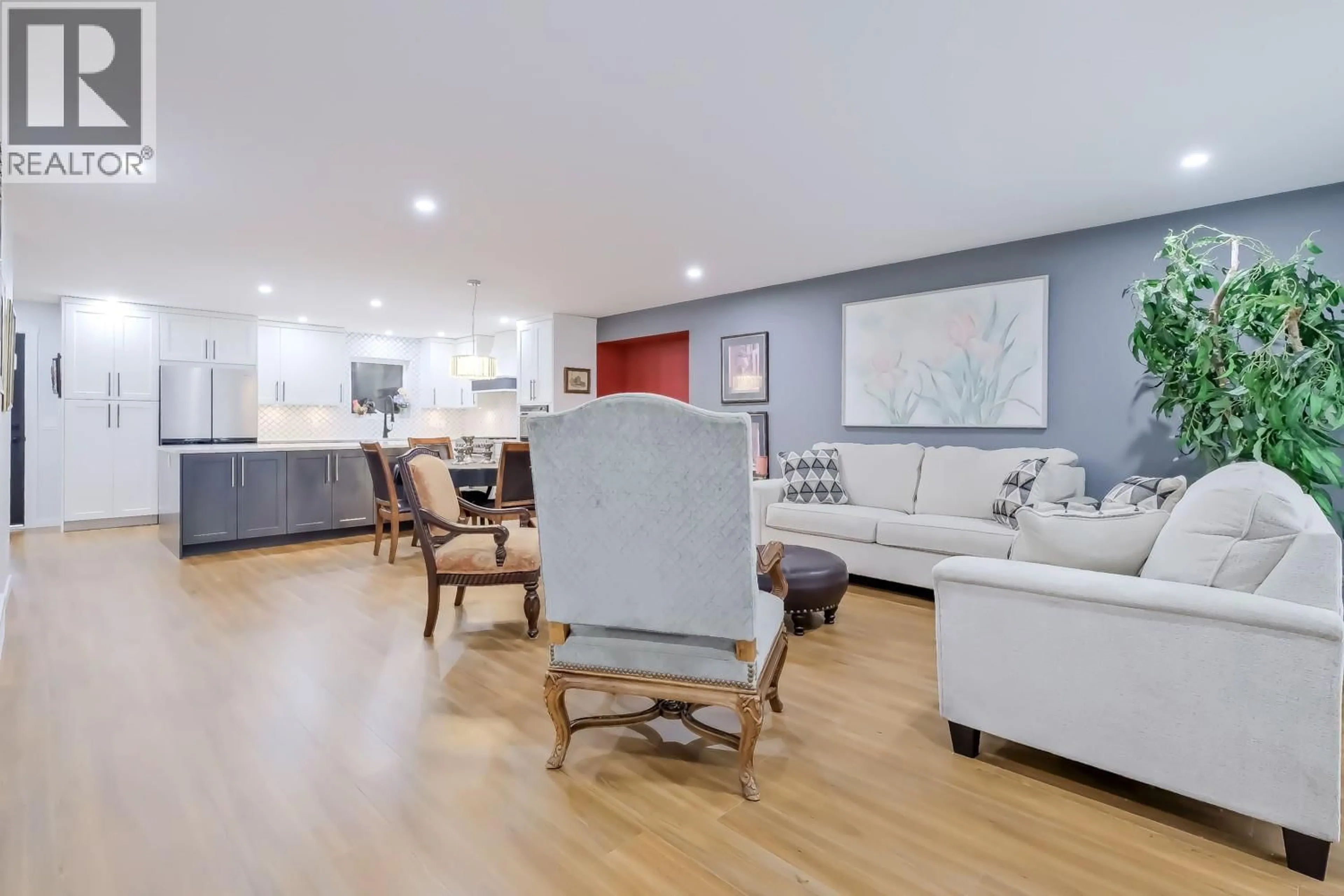 Living room with furniture, wood/laminate floor for 2830 PARIS STREET, Penticton British Columbia V2A8G2