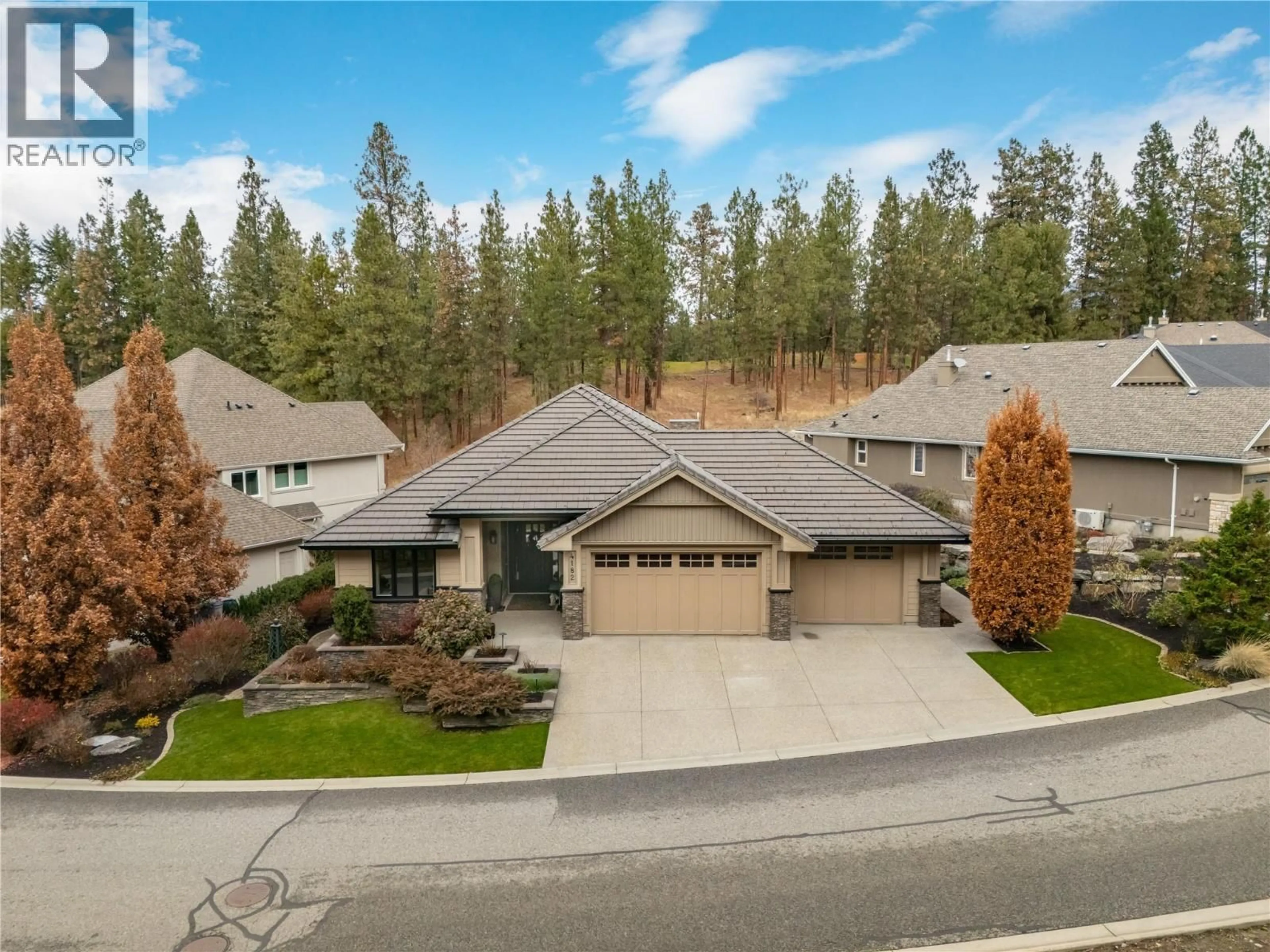A pic from outside/outdoor area/front of a property/back of a property/a pic from drone, mountain view for 4182 GALLAGHERS FAIRWAY SOUTH, Kelowna British Columbia V1W5G3