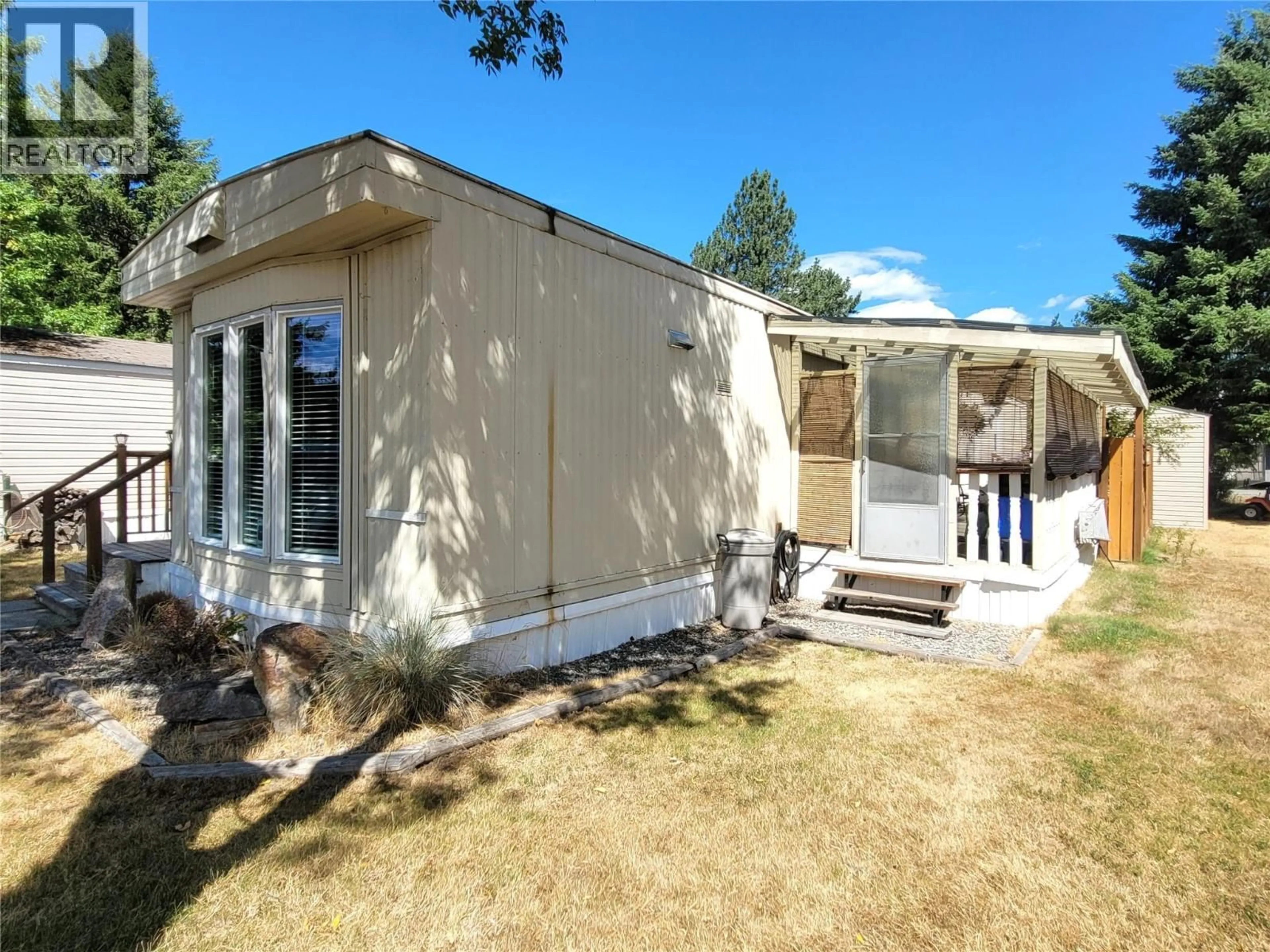 Home with vinyl exterior material, street for 15 - 7105 NORTH FORK ROAD, Grand Forks British Columbia V0H1H2