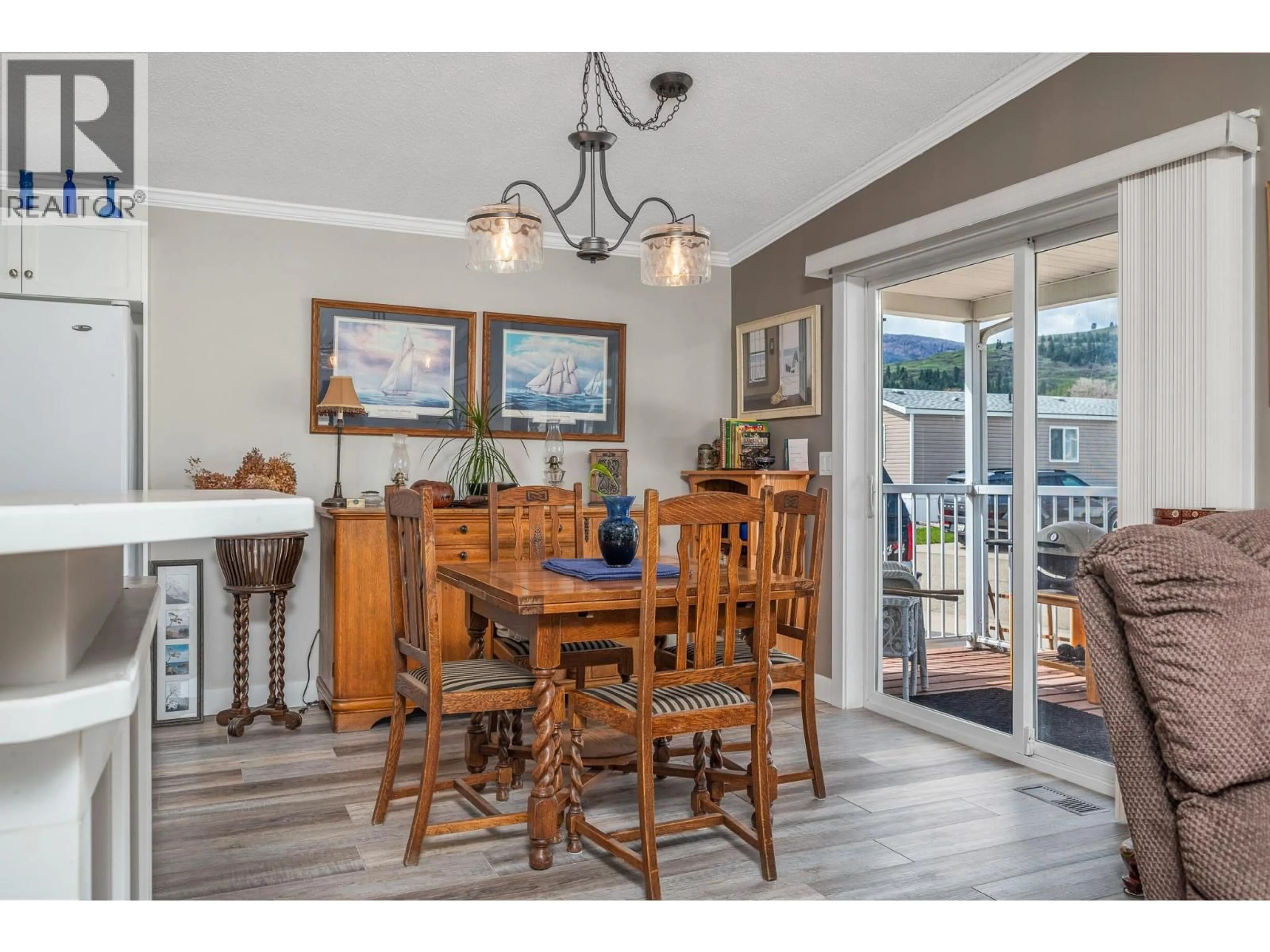 Dining room, wood/laminate floor for 21 - 12560 WESTSIDE ROAD, Vernon British Columbia V1H1S9