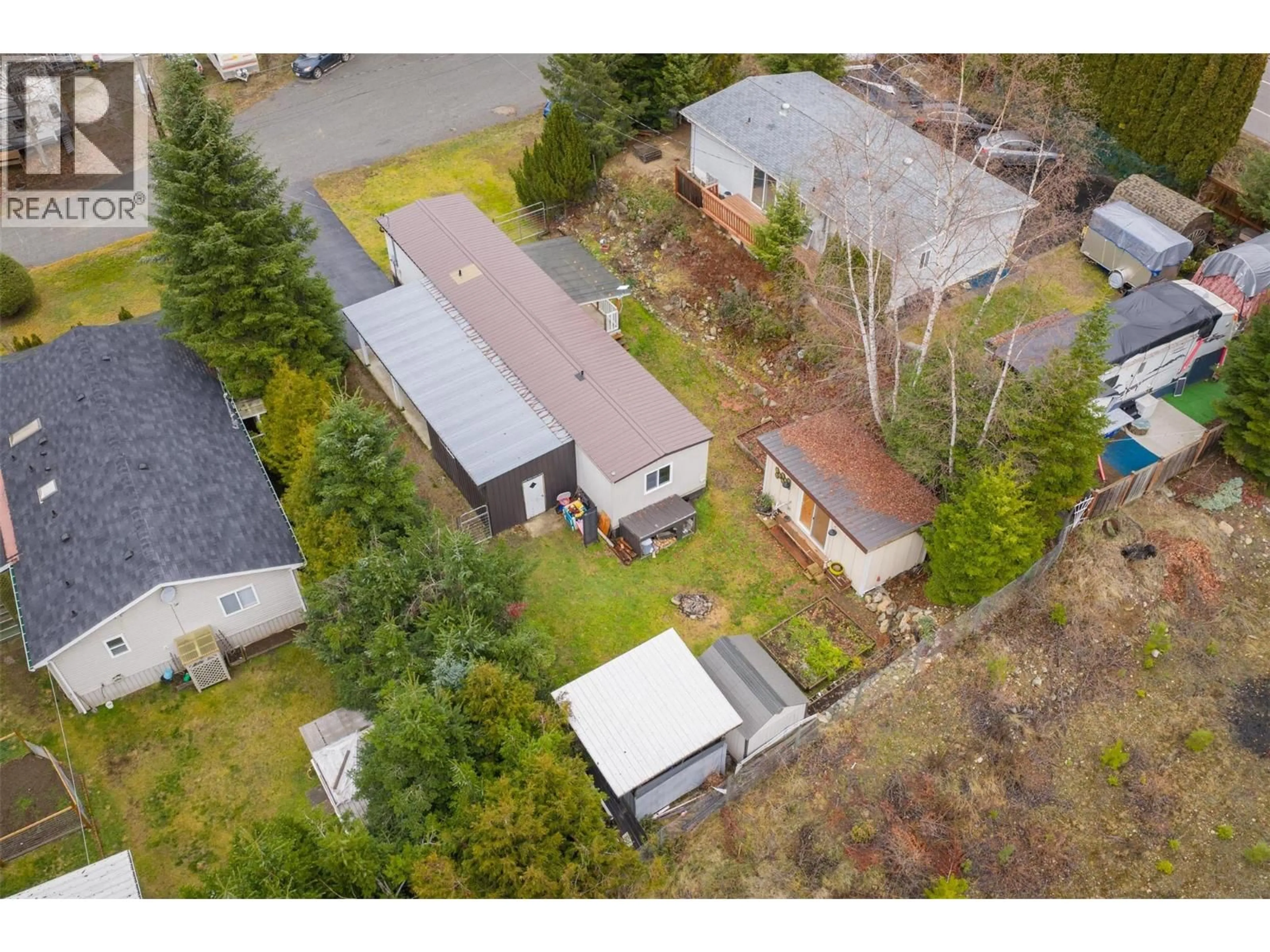 A pic from outside/outdoor area/front of a property/back of a property/a pic from drone, street for 1005 GARDEN ROAD, South Slocan British Columbia V0G2G1
