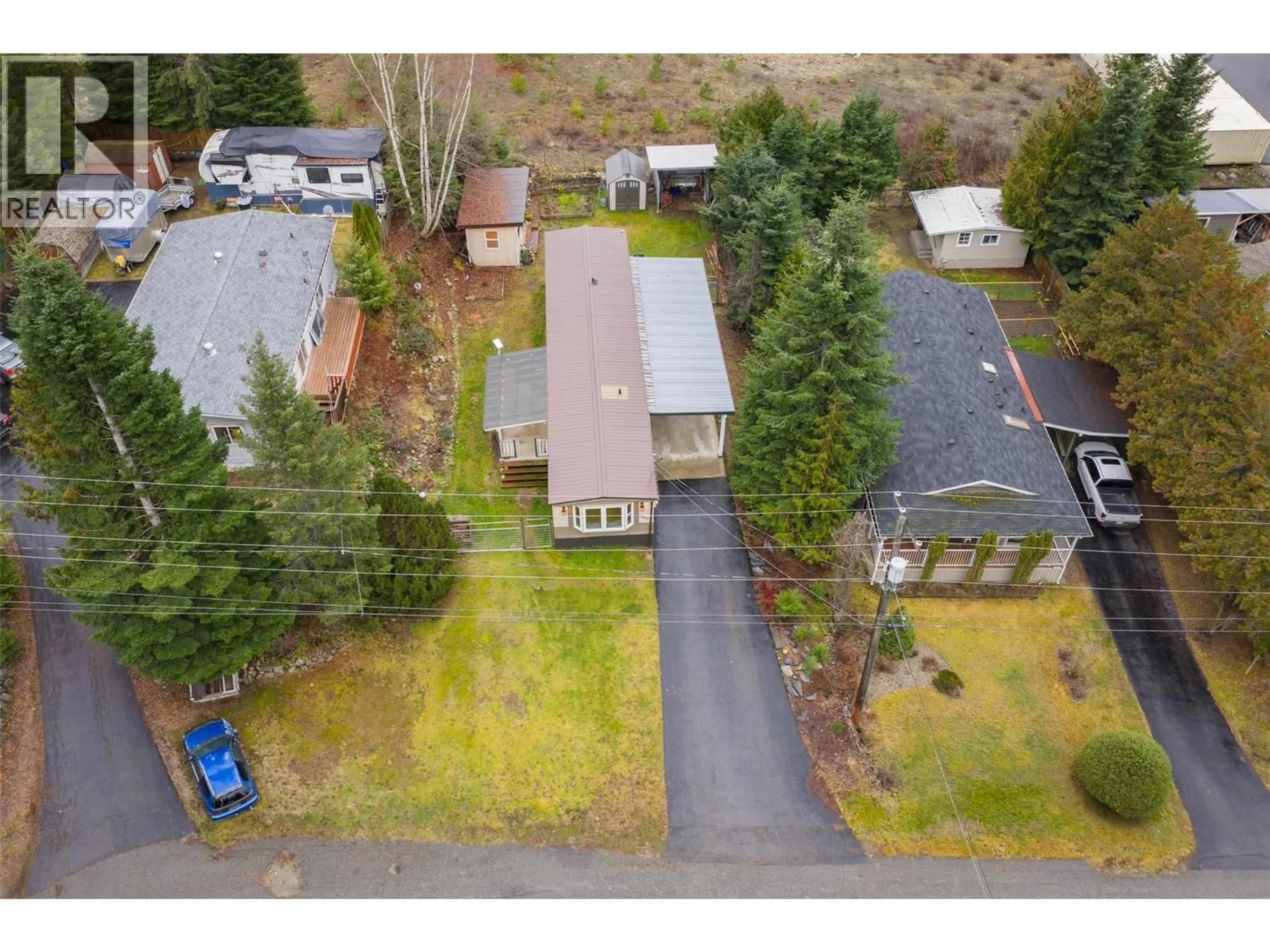 A pic from outside/outdoor area/front of a property/back of a property/a pic from drone, street for 1005 GARDEN ROAD, South Slocan British Columbia V0G2G1