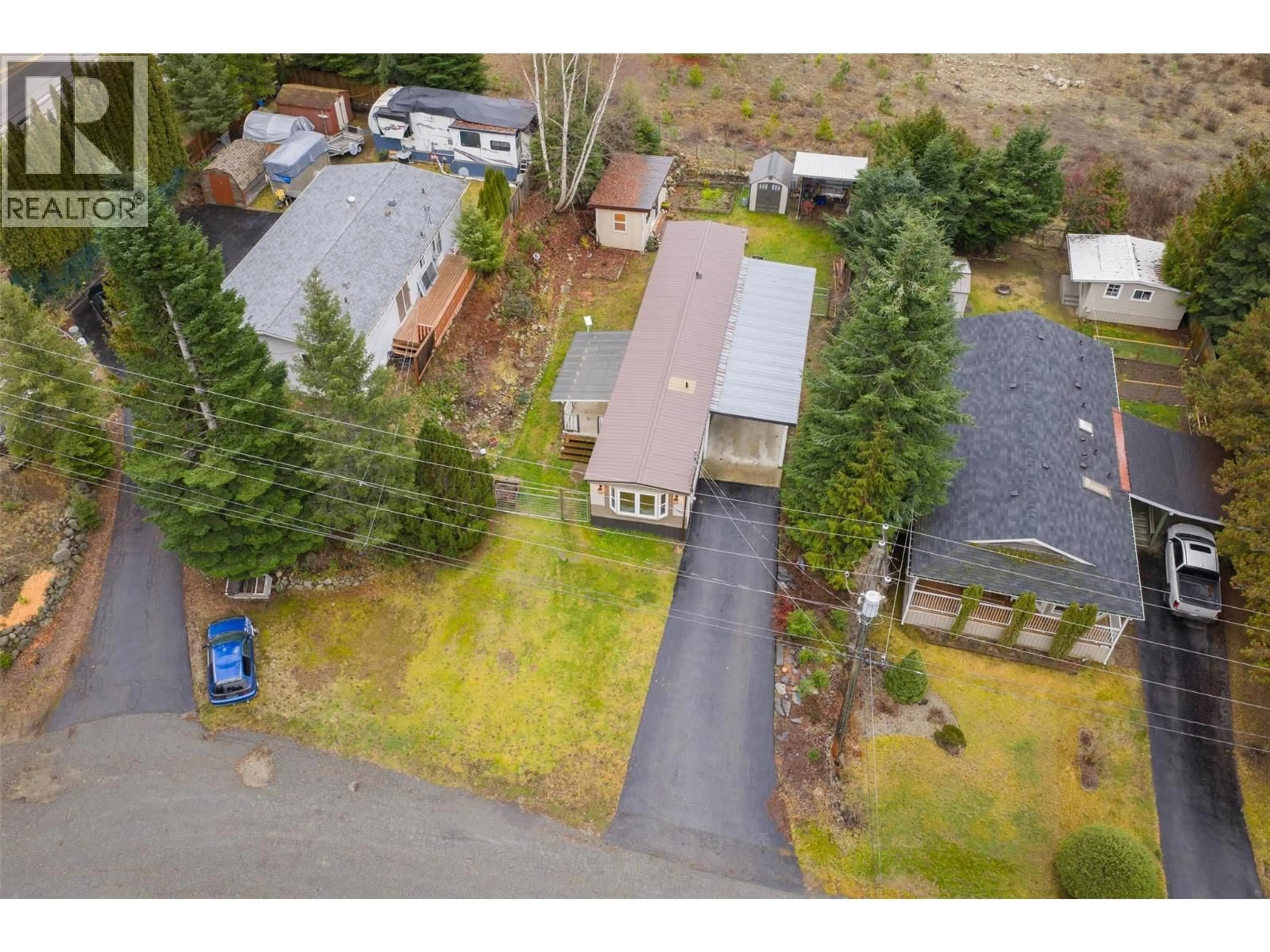 A pic from outside/outdoor area/front of a property/back of a property/a pic from drone, street for 1005 GARDEN ROAD, South Slocan British Columbia V0G2G1