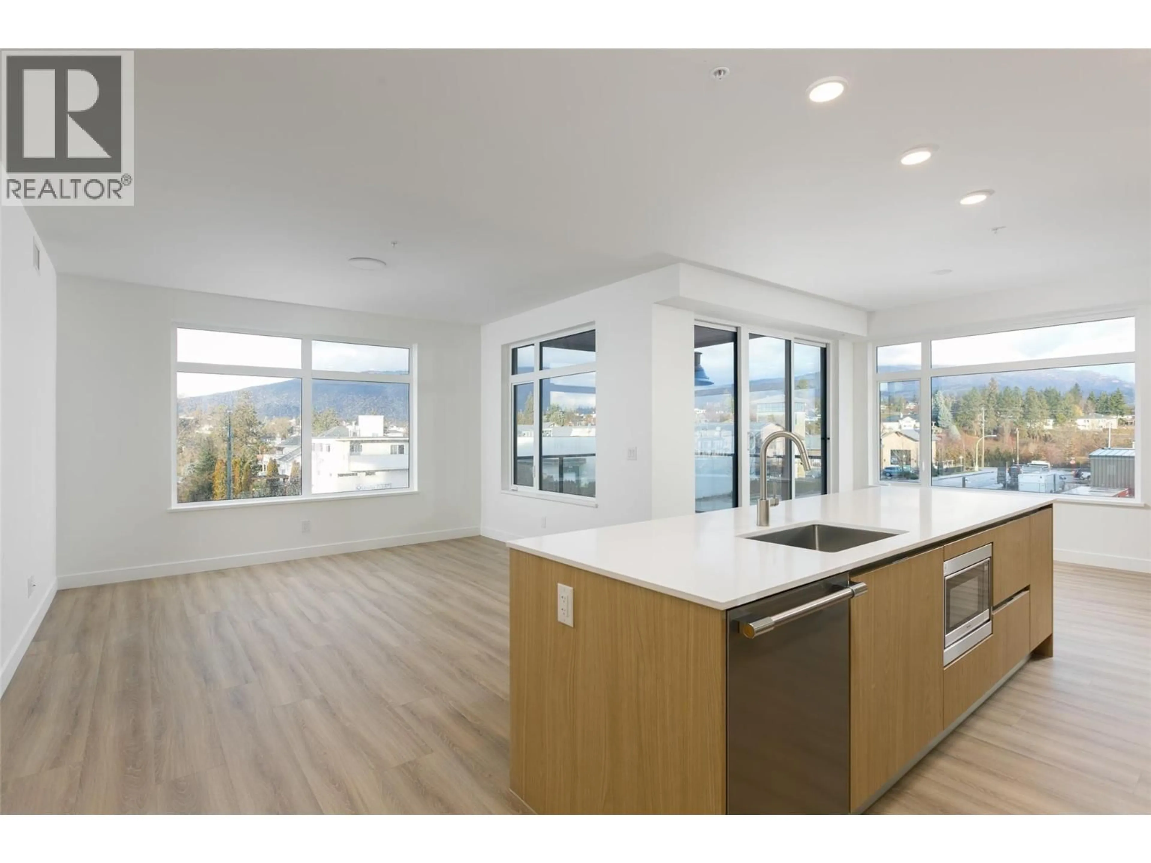 Open concept kitchen, wood/laminate floor for 301 - 2760 OLALLA ROAD, West Kelowna British Columbia V1Z0C7