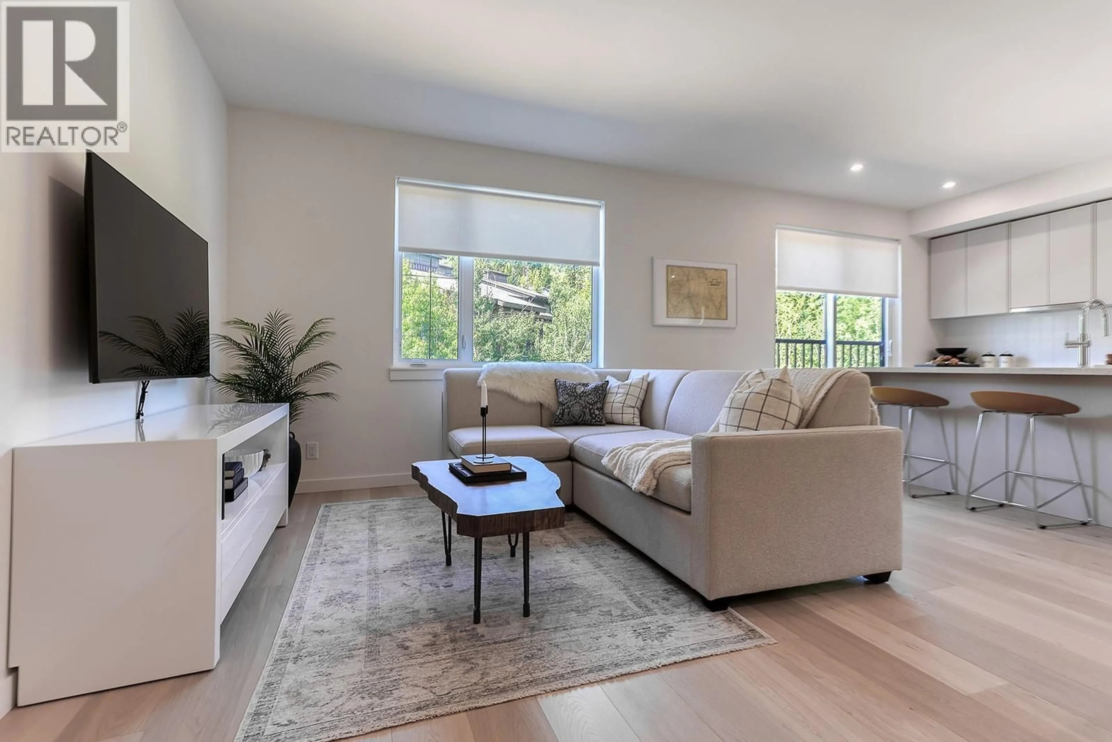 Living room with furniture, wood/laminate floor for 111 - 4280 RED MOUNTAIN ROAD, Rossland British Columbia V0G1Y0