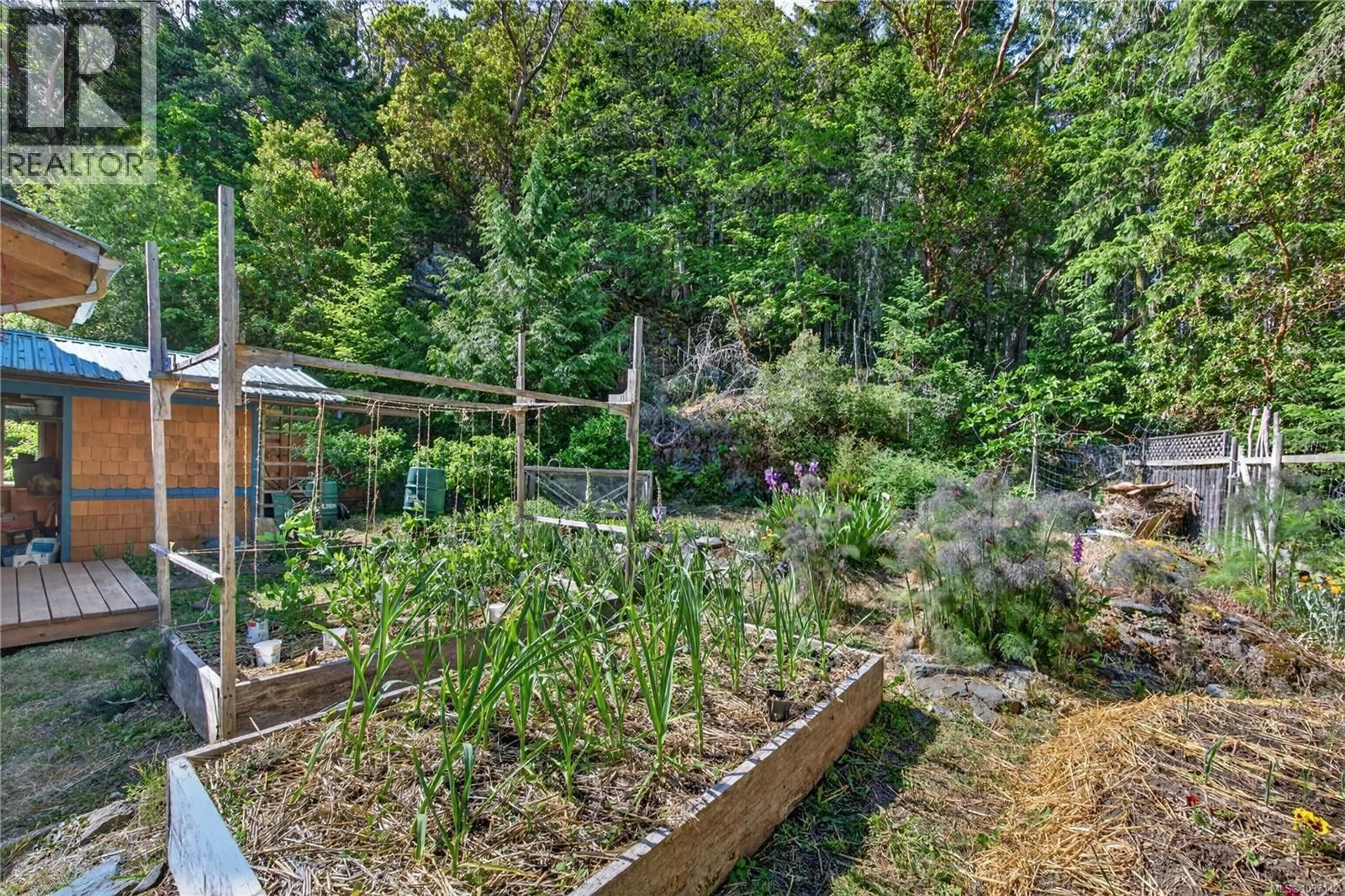 A pic from outside/outdoor area/front of a property/back of a property/a pic from drone, forest/trees view for 1252 ISABELLA POINT ROAD, Salt Spring British Columbia V8K2T9