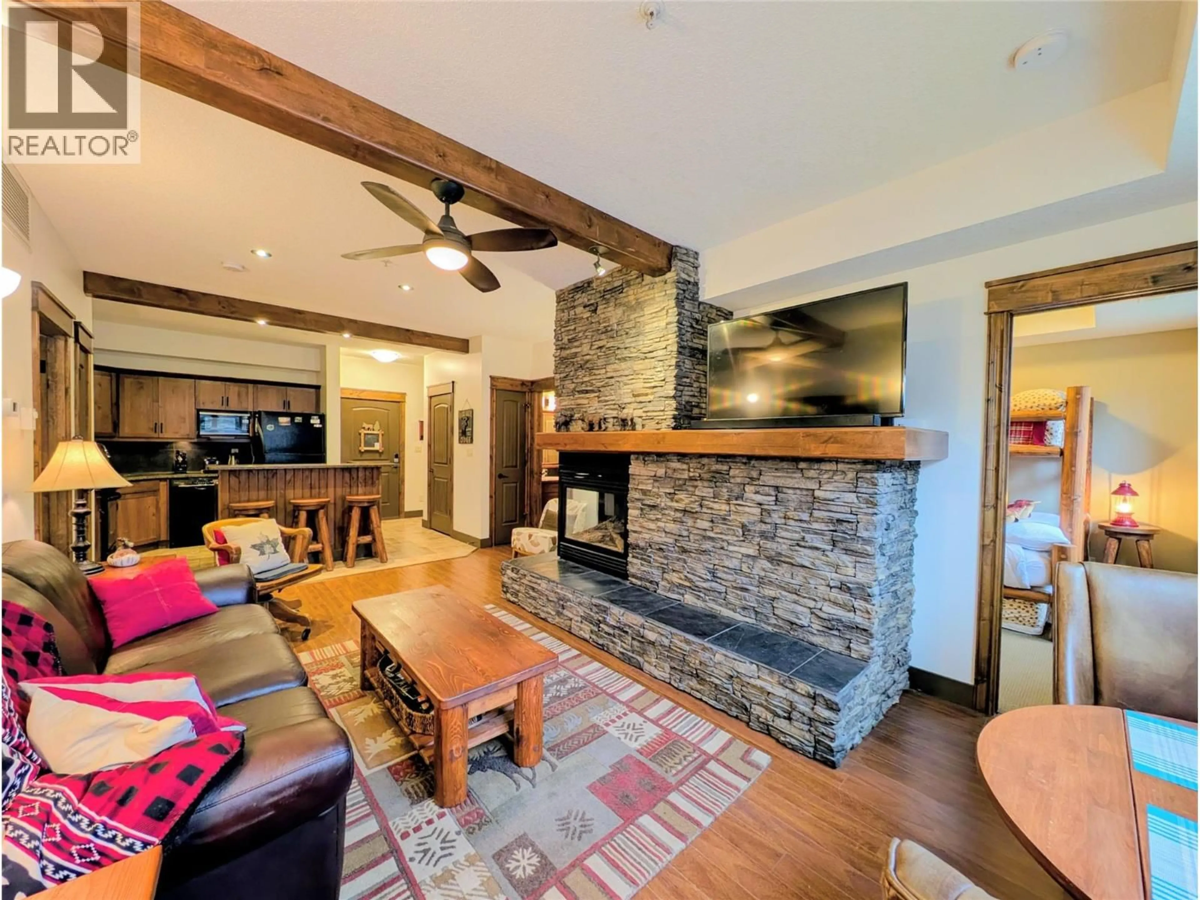 Living room with furniture, unknown for 2113 - 7495 COLUMBIA AVENUE, Radium Hot Springs British Columbia V0A1M0