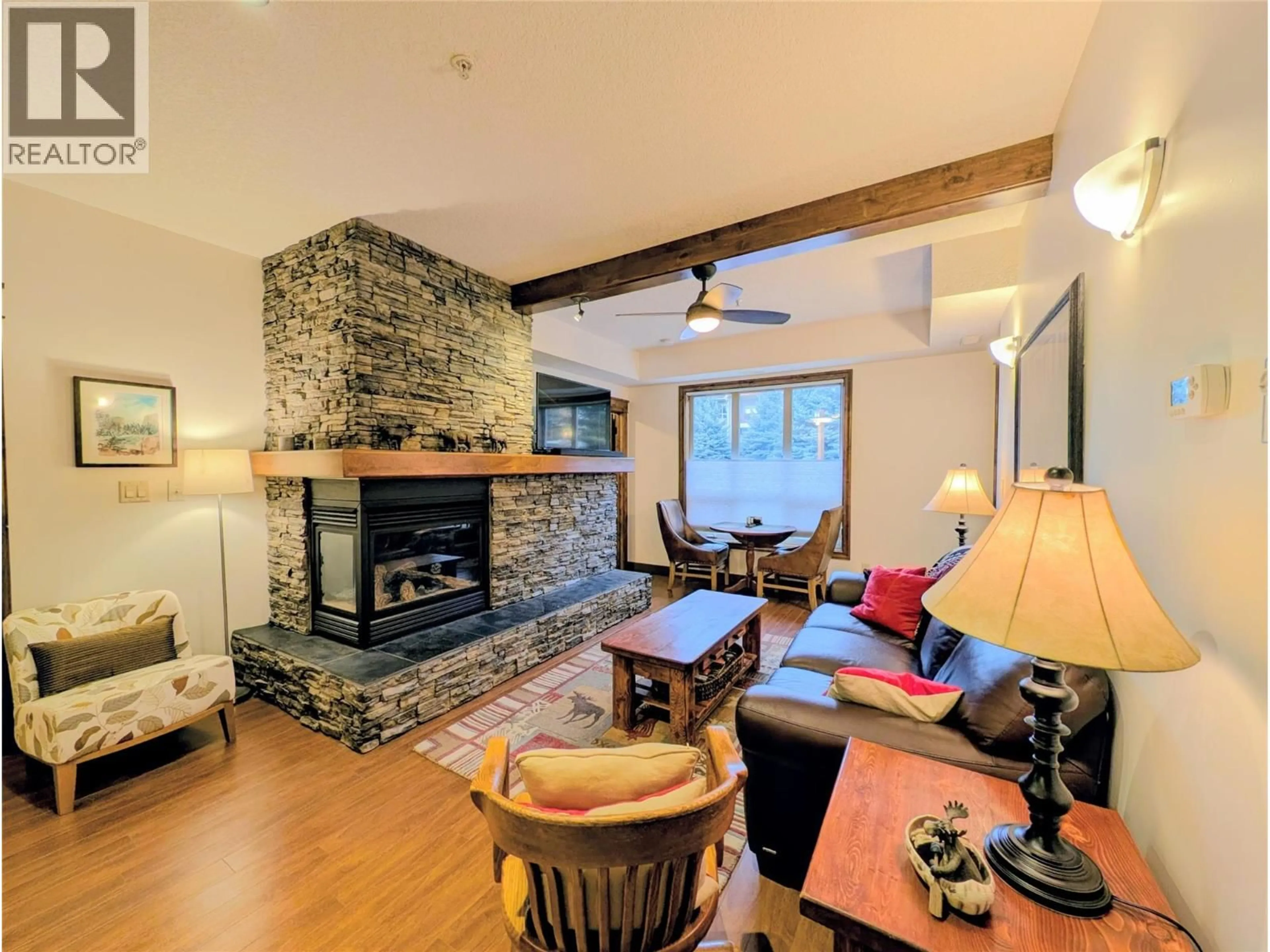 Living room with furniture, wood/laminate floor for 2113 - 7495 COLUMBIA AVENUE, Radium Hot Springs British Columbia V0A1M0