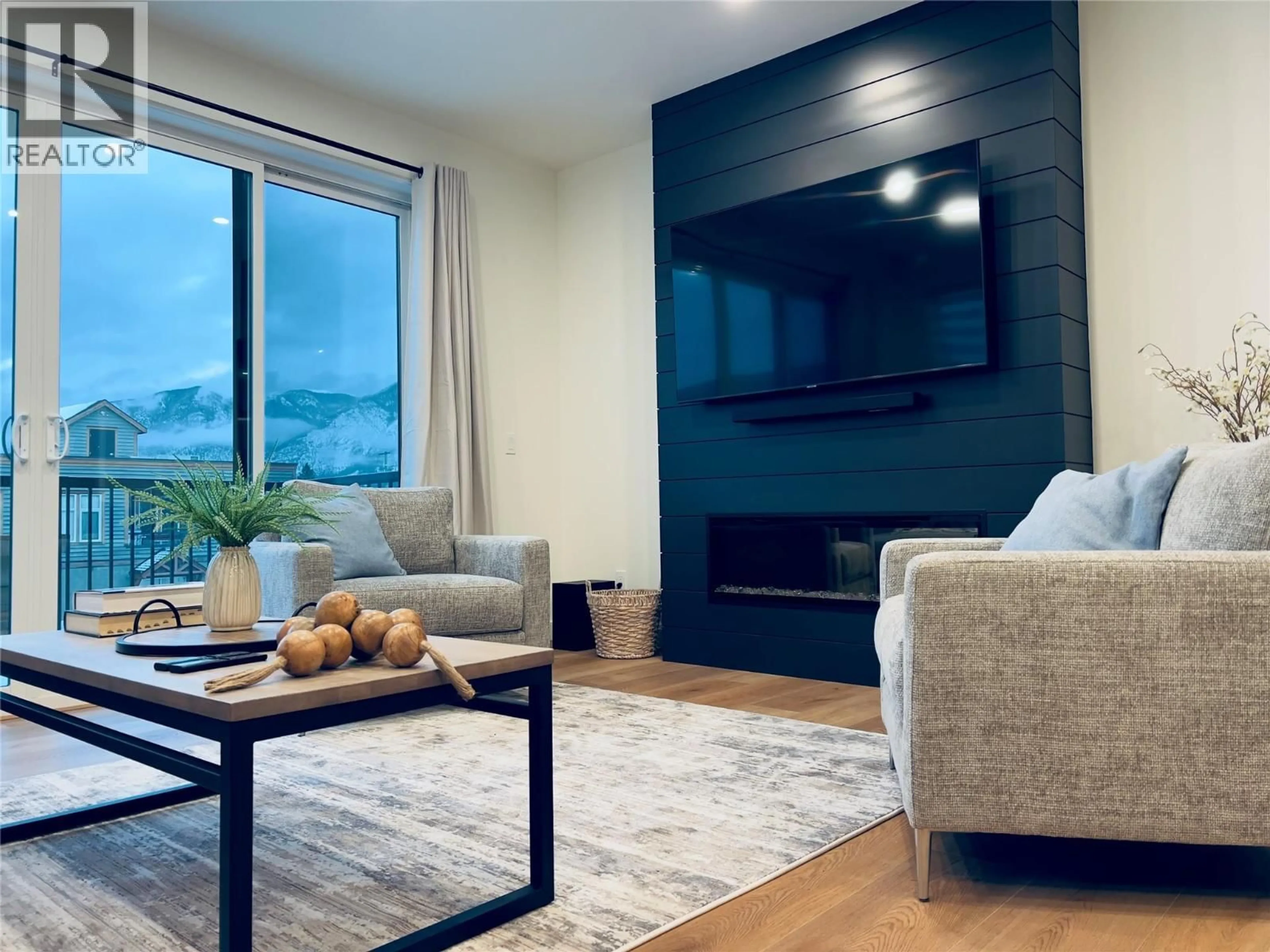 Living room with furniture, wood/laminate floor for 402 - 510 14TH STREET, Invermere British Columbia V0A1K0
