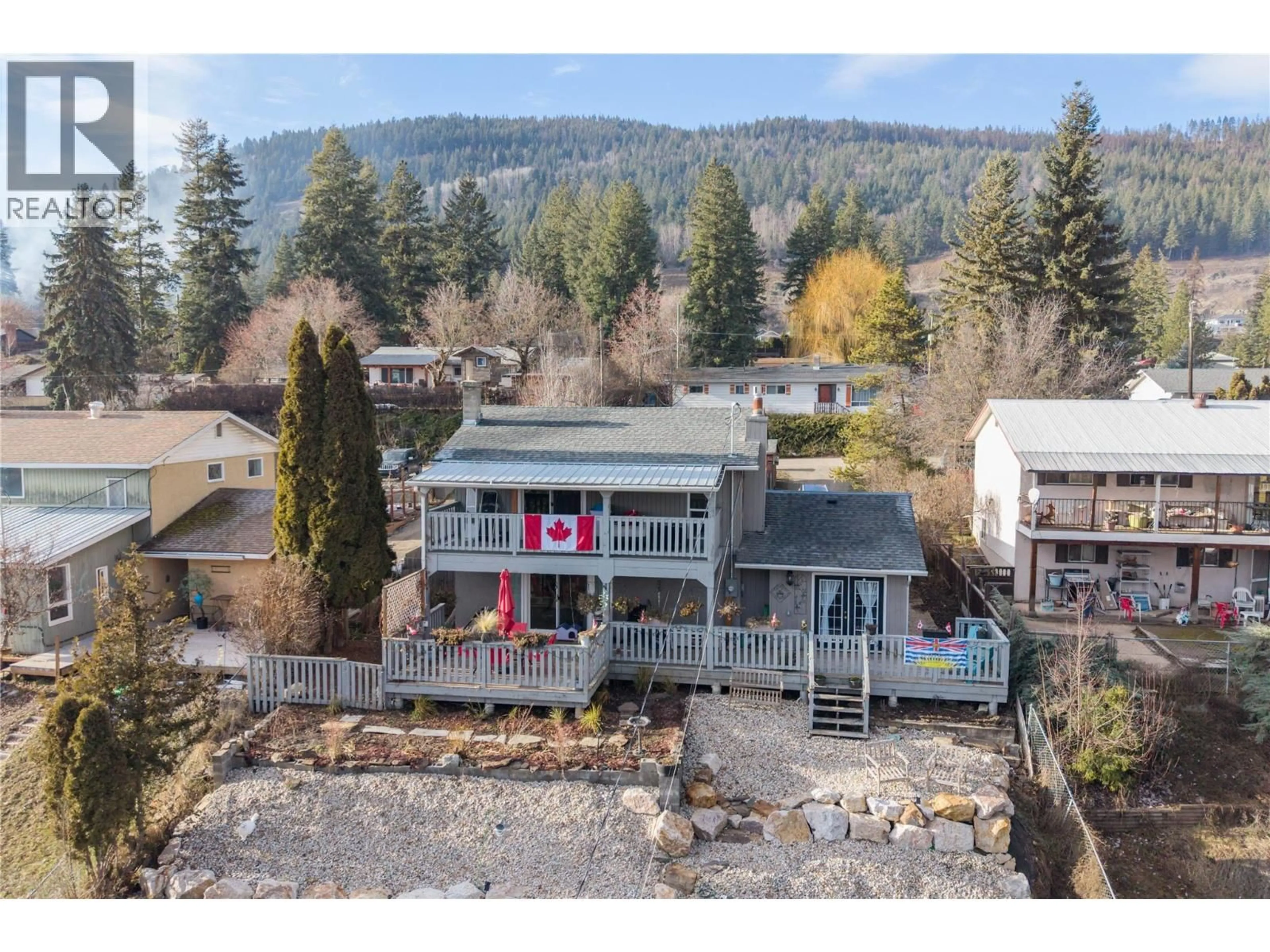 A pic from outside/outdoor area/front of a property/back of a property/a pic from drone, mountain view for 2138 CATT AVENUE, Lumby British Columbia V0E2G0