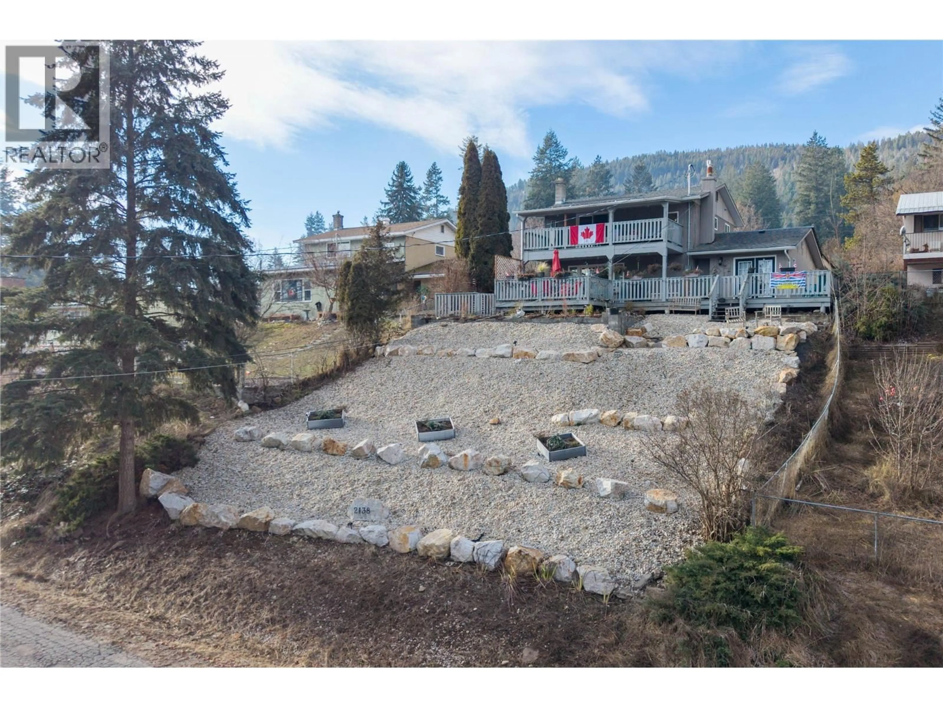 A pic from outside/outdoor area/front of a property/back of a property/a pic from drone, mountain view for 2138 CATT AVENUE, Lumby British Columbia V0E2G0