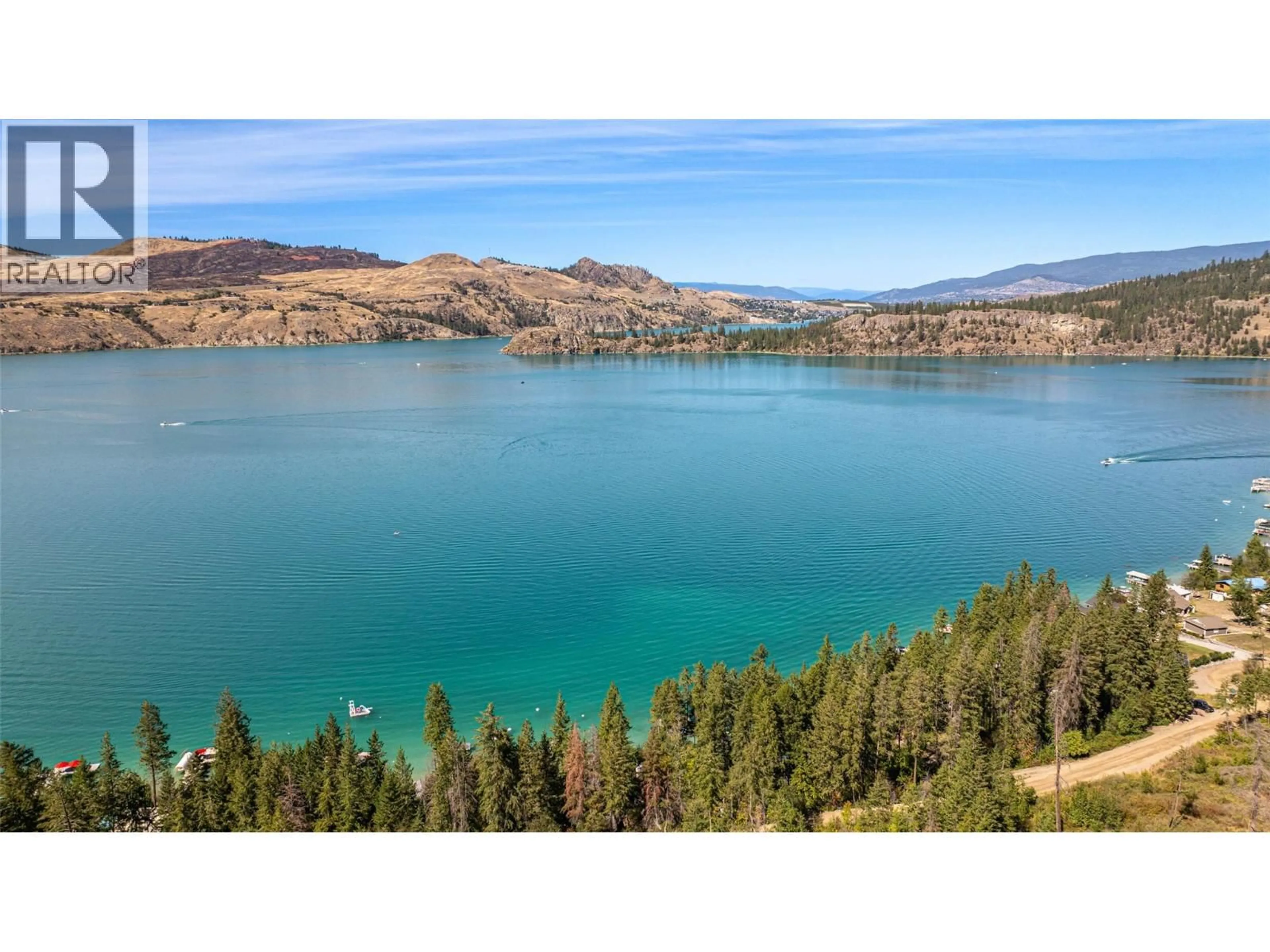 A pic from outside/outdoor area/front of a property/back of a property/a pic from drone, water/lake/river/ocean view for 5799 COSENS BAY ROAD, Coldstream British Columbia V1B1N8