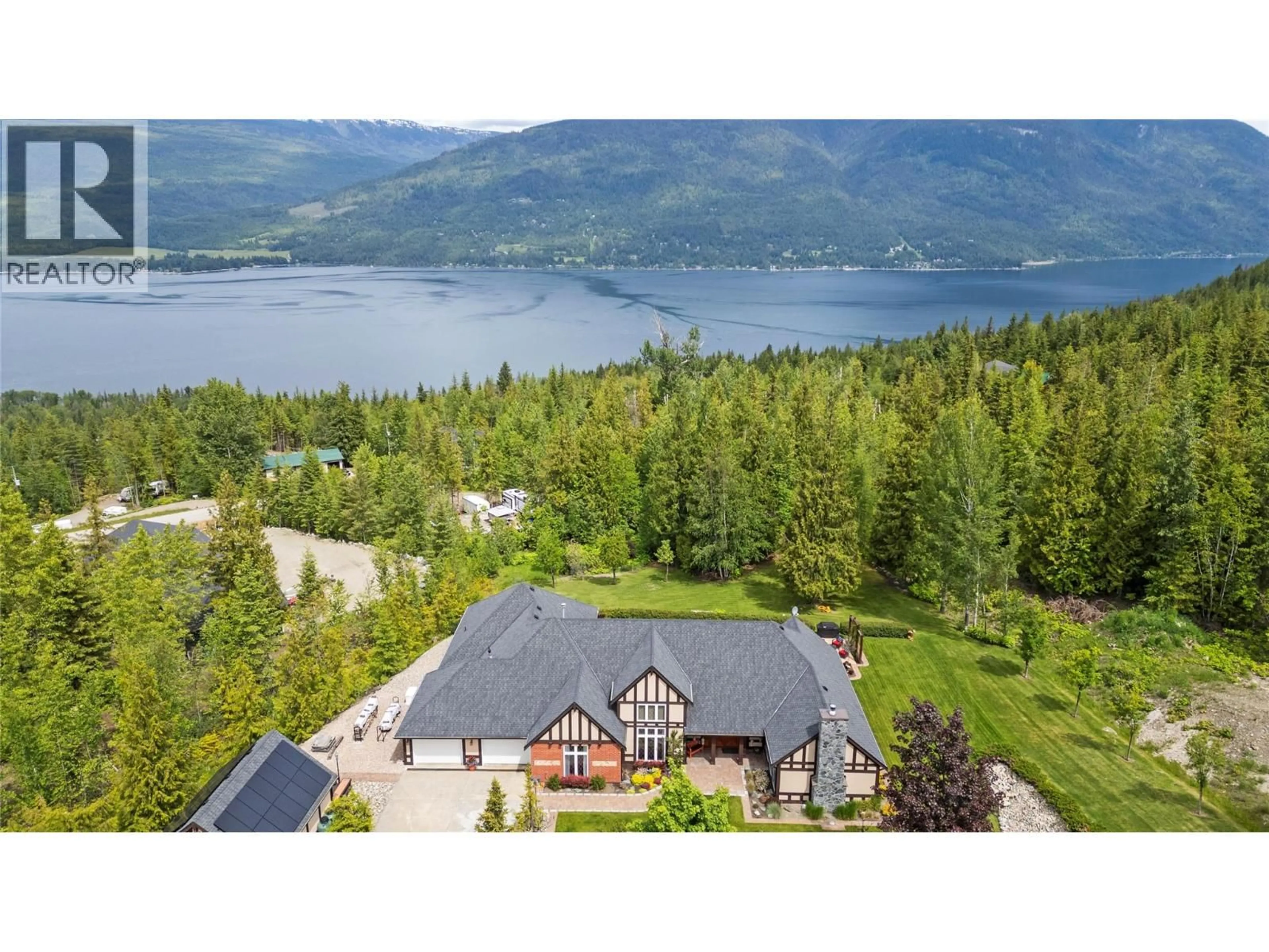 A pic from outside/outdoor area/front of a property/back of a property/a pic from drone, water/lake/river/ocean view for 5121 IVY ROAD, Eagle Bay British Columbia V0E1T0