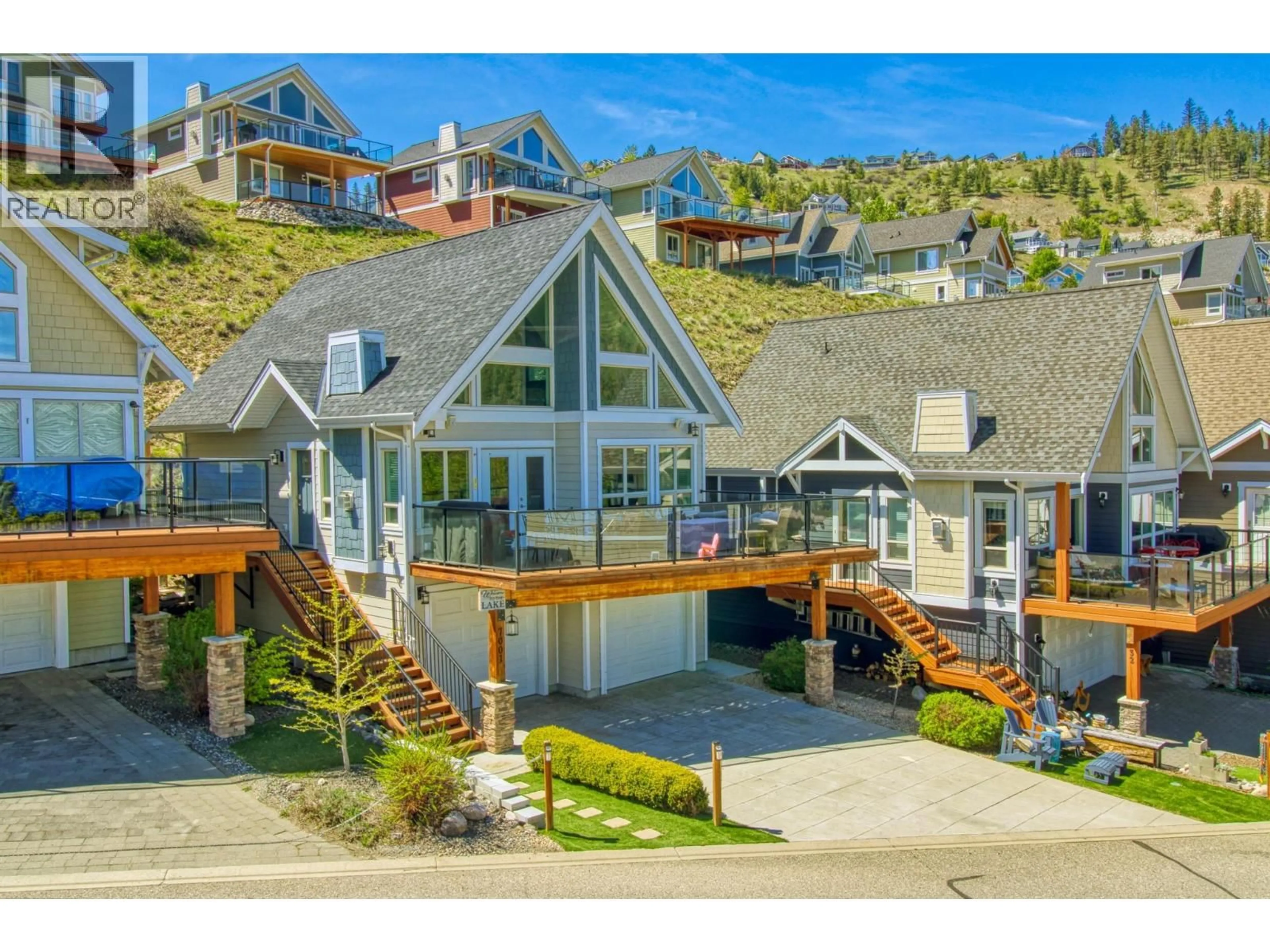 A pic from outside/outdoor area/front of a property/back of a property/a pic from drone, mountain view for 33 - 7001 BARCELONA DRIVE, Kelowna British Columbia V1Z3R8