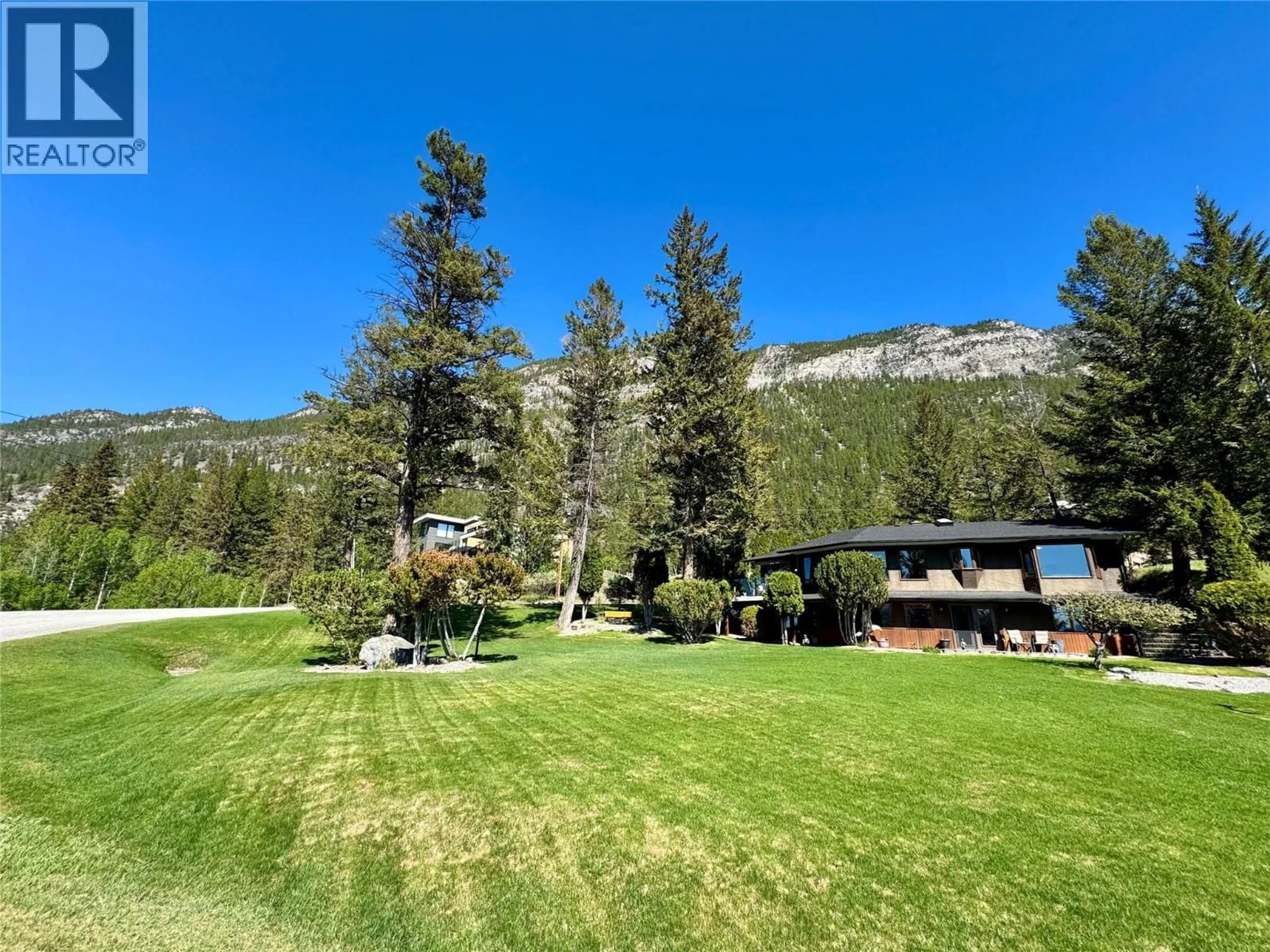 A pic from outside/outdoor area/front of a property/back of a property/a pic from drone, mountain view for 8380 RICHARDSON CRESCENT, Canal Flats British Columbia V0B1B0