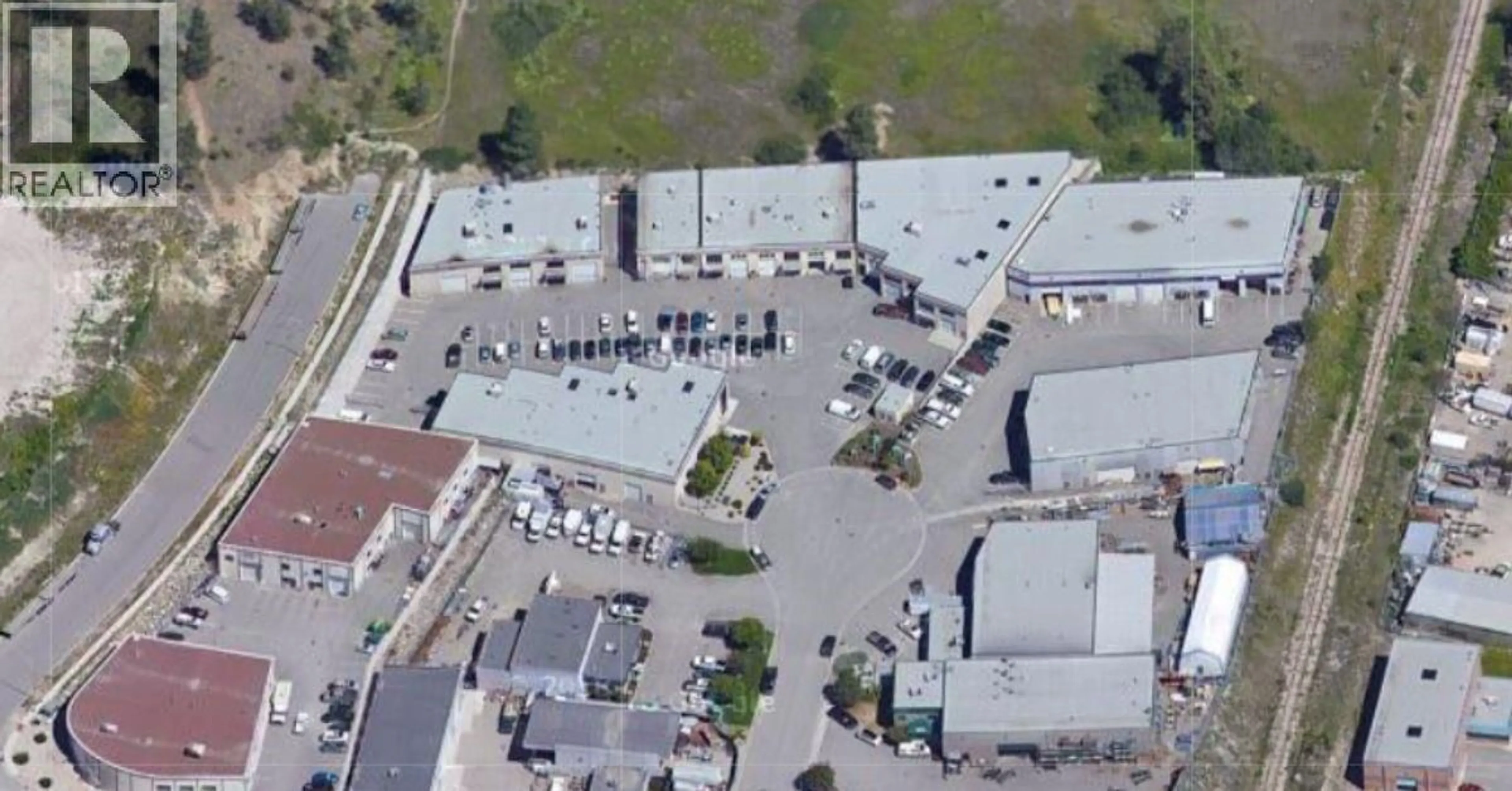 A pic from outside/outdoor area/front of a property/back of a property/a pic from drone, street for 102 - 460 NAEVE COURT, Kelowna British Columbia V1V2M2