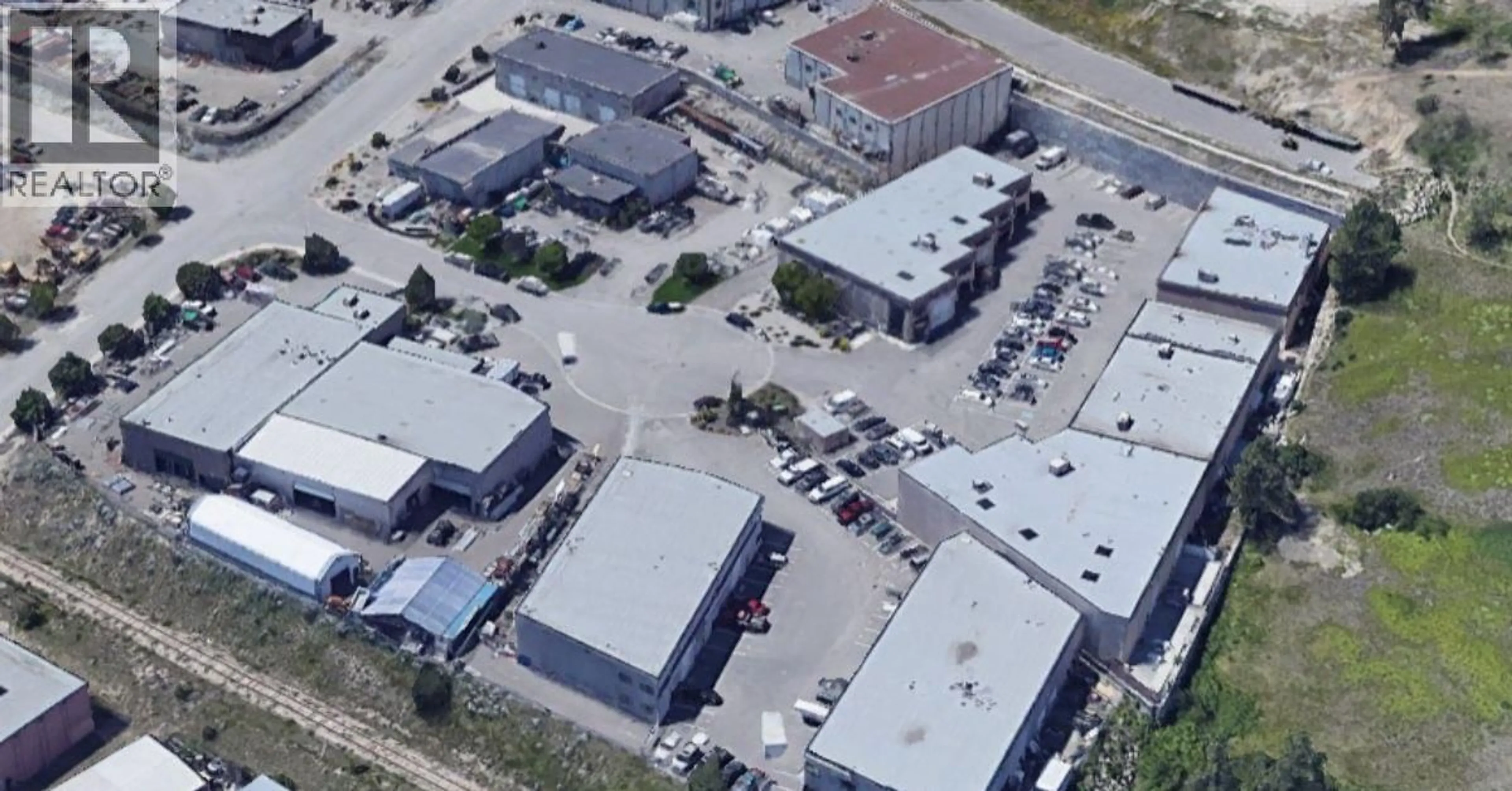 A pic from outside/outdoor area/front of a property/back of a property/a pic from drone, street for 102 - 460 NAEVE COURT, Kelowna British Columbia V1V2M2