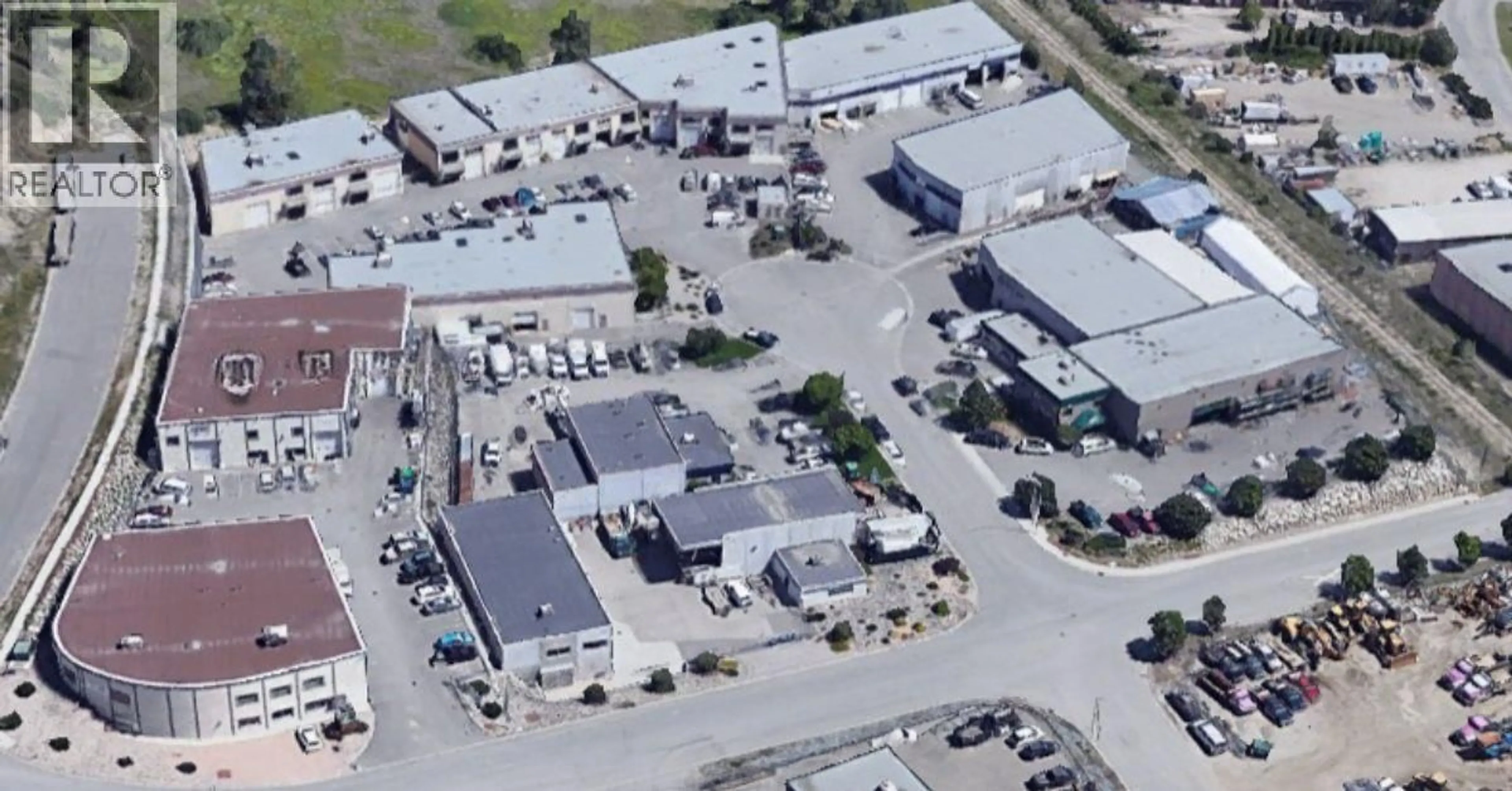 A pic from outside/outdoor area/front of a property/back of a property/a pic from drone, street for 102 - 460 NAEVE COURT, Kelowna British Columbia V1V2M2