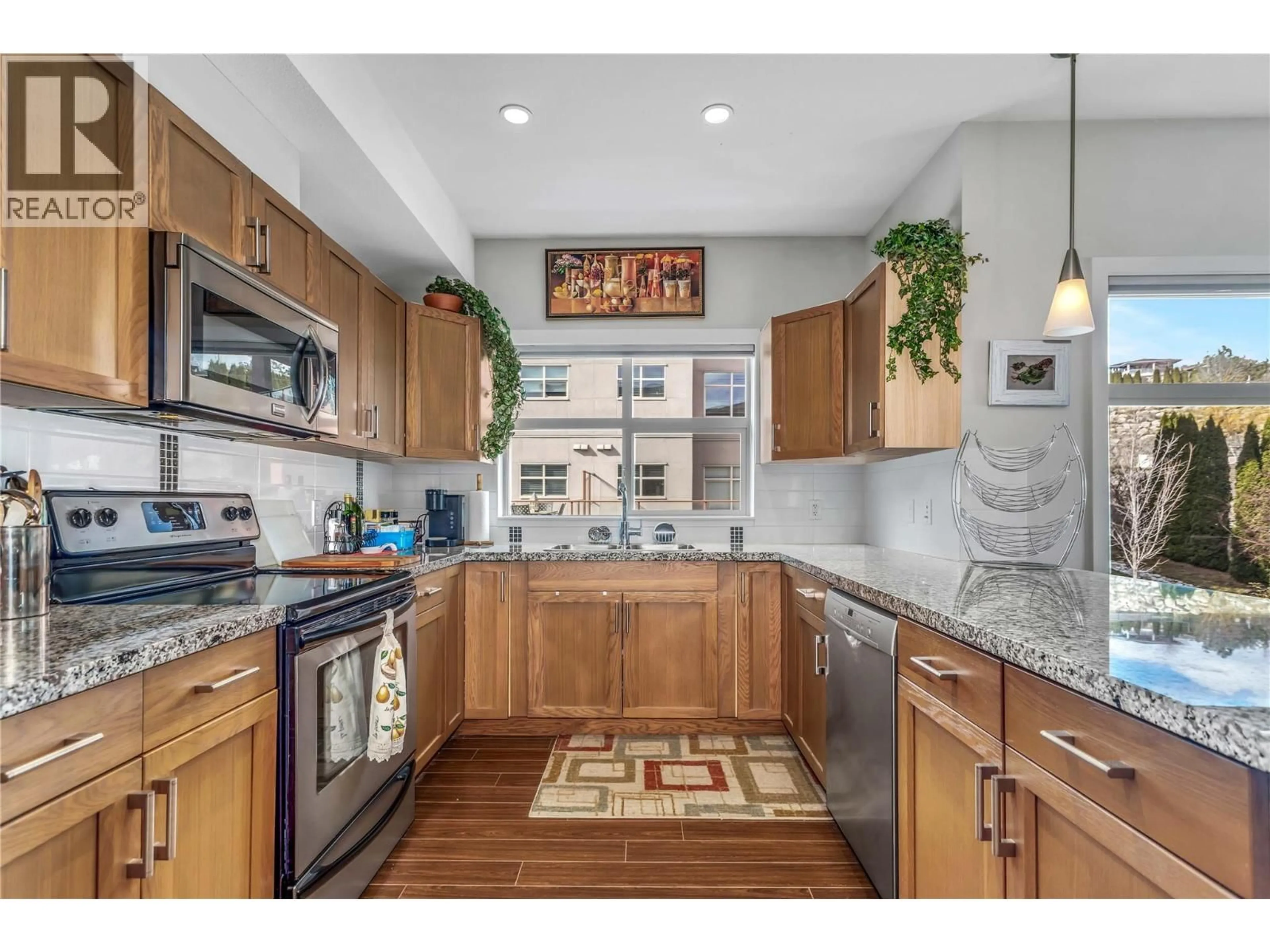 Open concept kitchen, ceramic/tile floor for 409 - 3205 SKYVIEW LANE, West Kelowna British Columbia V4T3J3