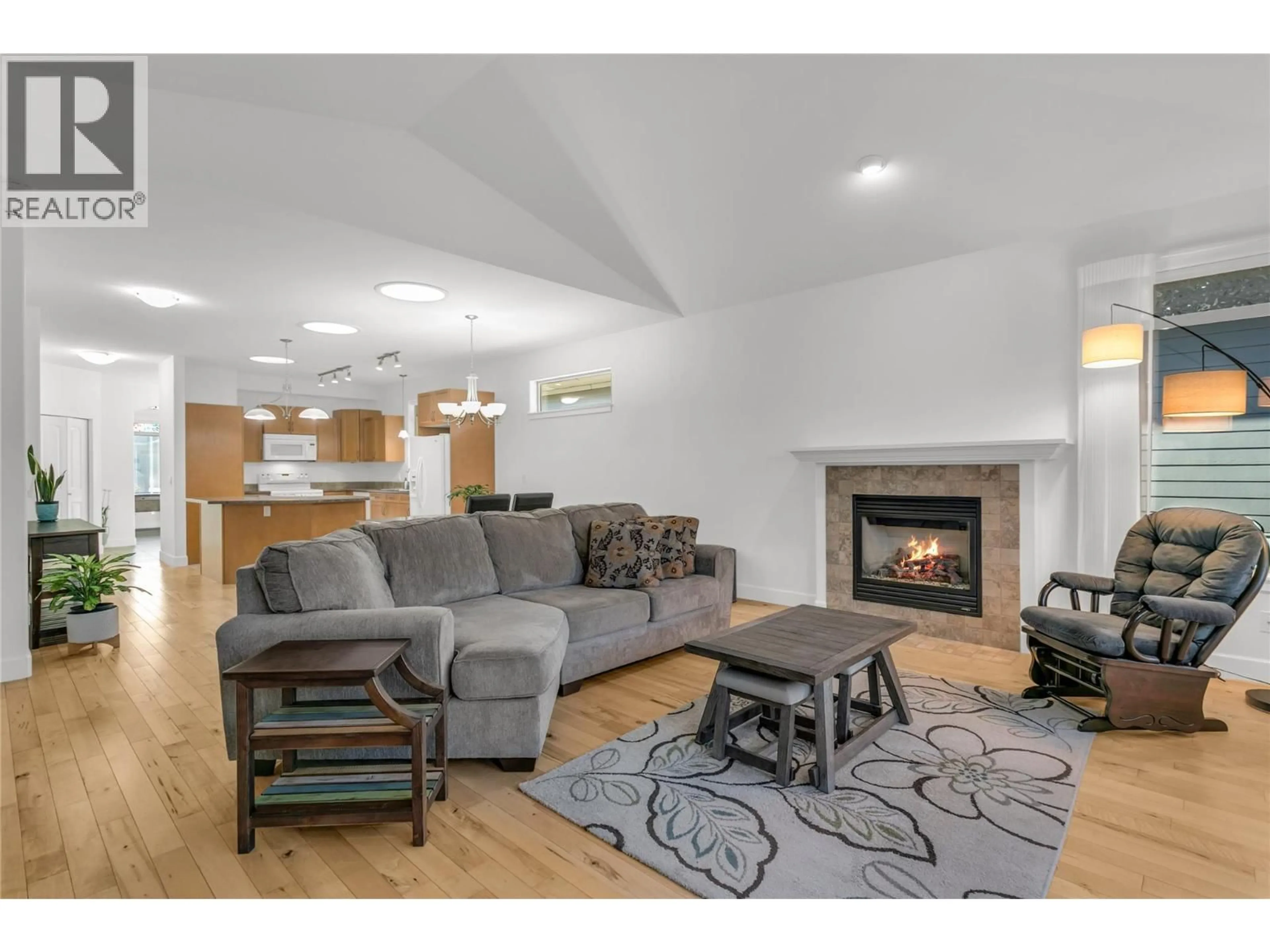 Living room with furniture, wood/laminate floor for 153 - 4035 GELLATLY ROAD SOUTH, West Kelowna British Columbia V4T1R7