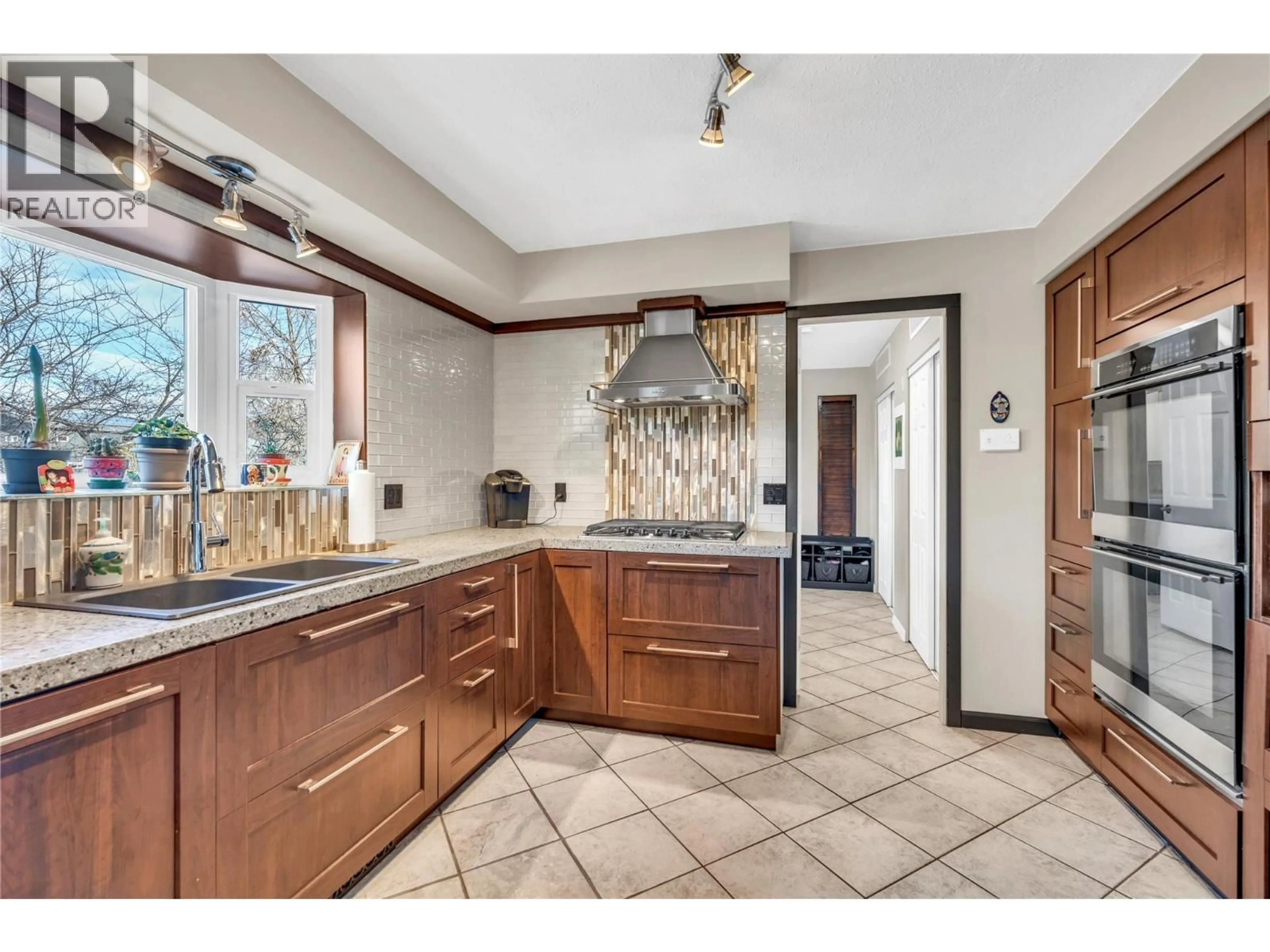 Open concept kitchen, ceramic/tile floor for 10112 BEAVIS PLACE, Summerland British Columbia V0H1Z2