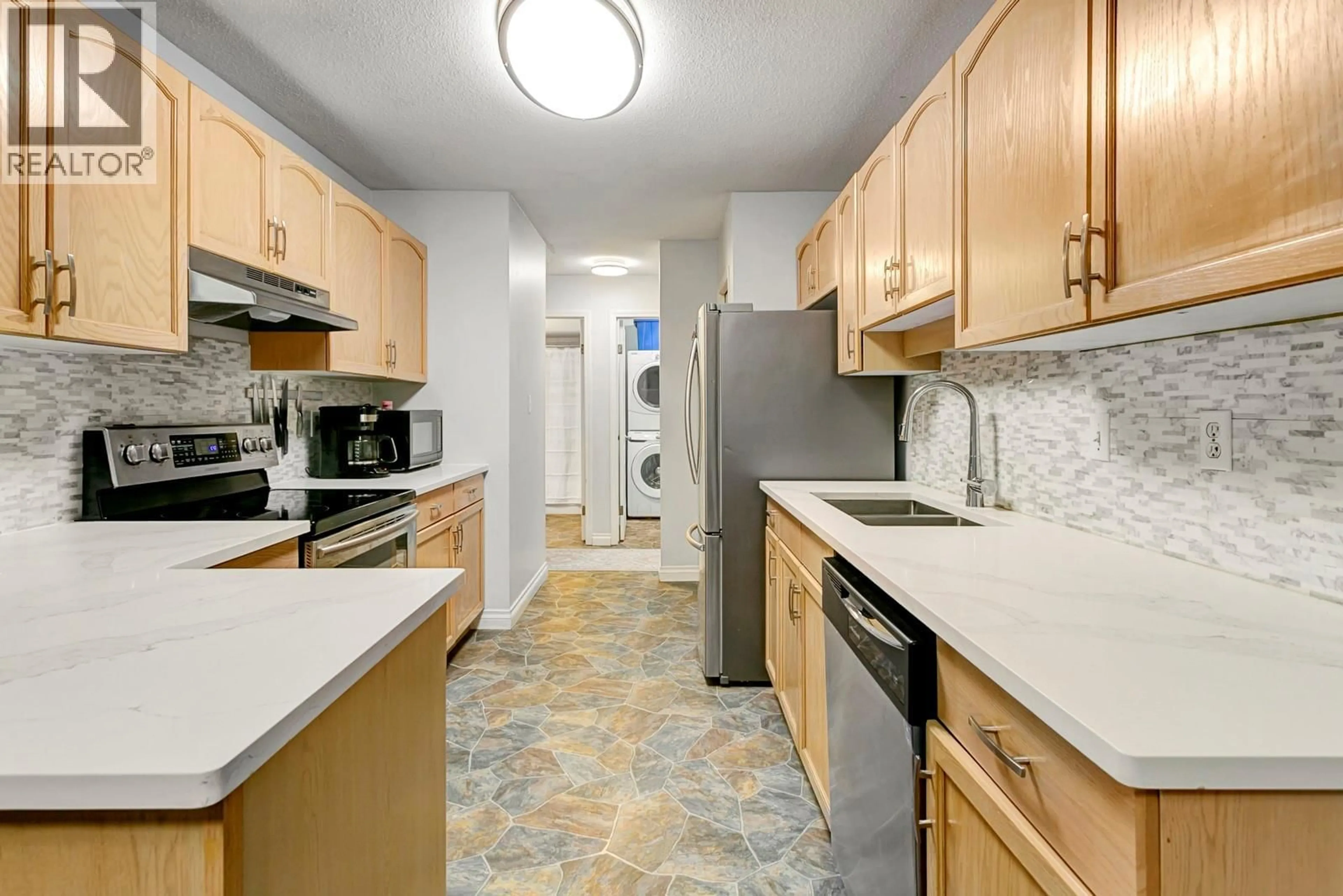 Standard kitchen, ceramic/tile floor for 219 - 3163 RICHTER STREET, Kelowna British Columbia V1W3R4