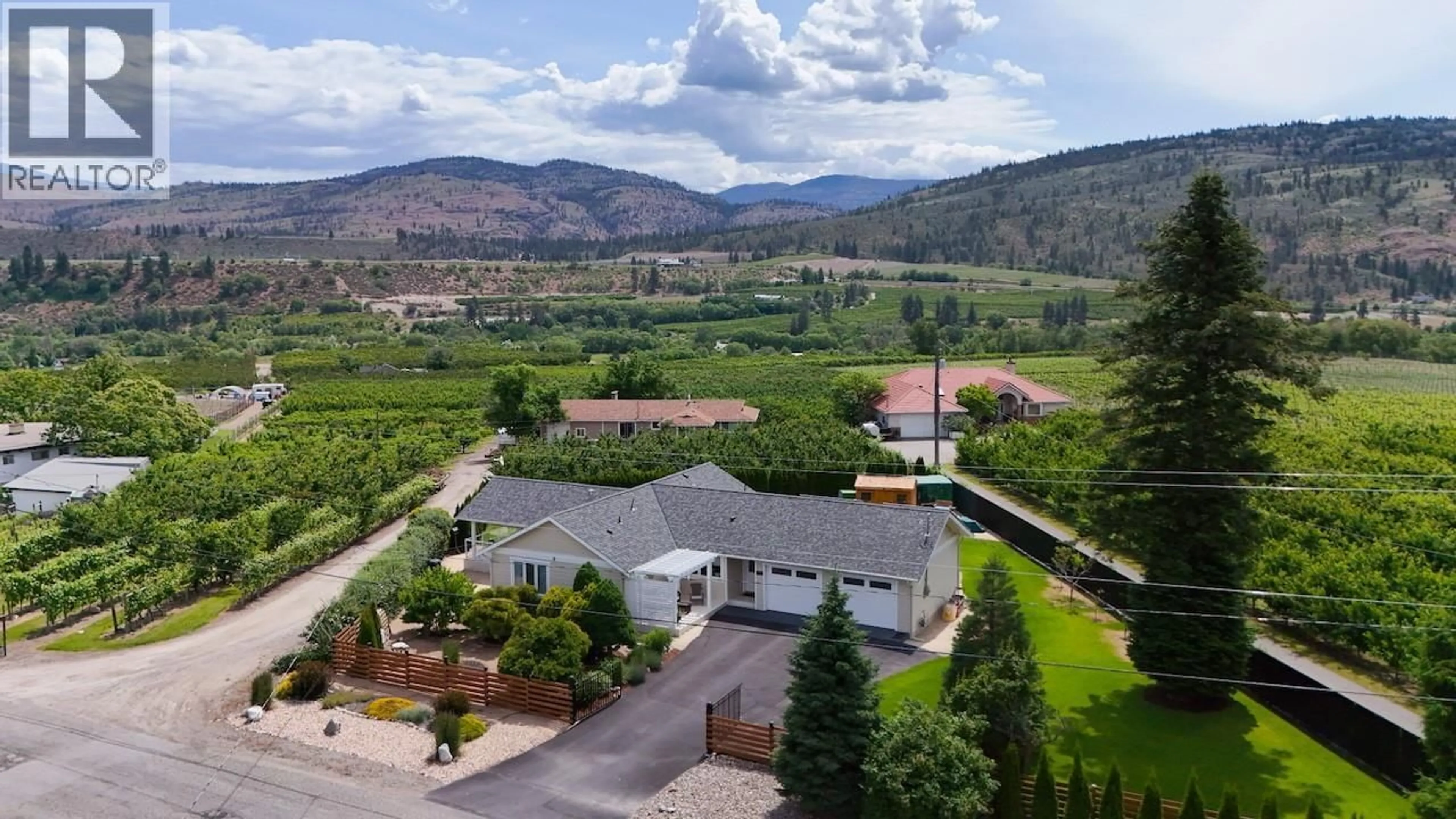 A pic from outside/outdoor area/front of a property/back of a property/a pic from drone, mountain view for 5609 YARROW STREET, Oliver British Columbia V0H1T9
