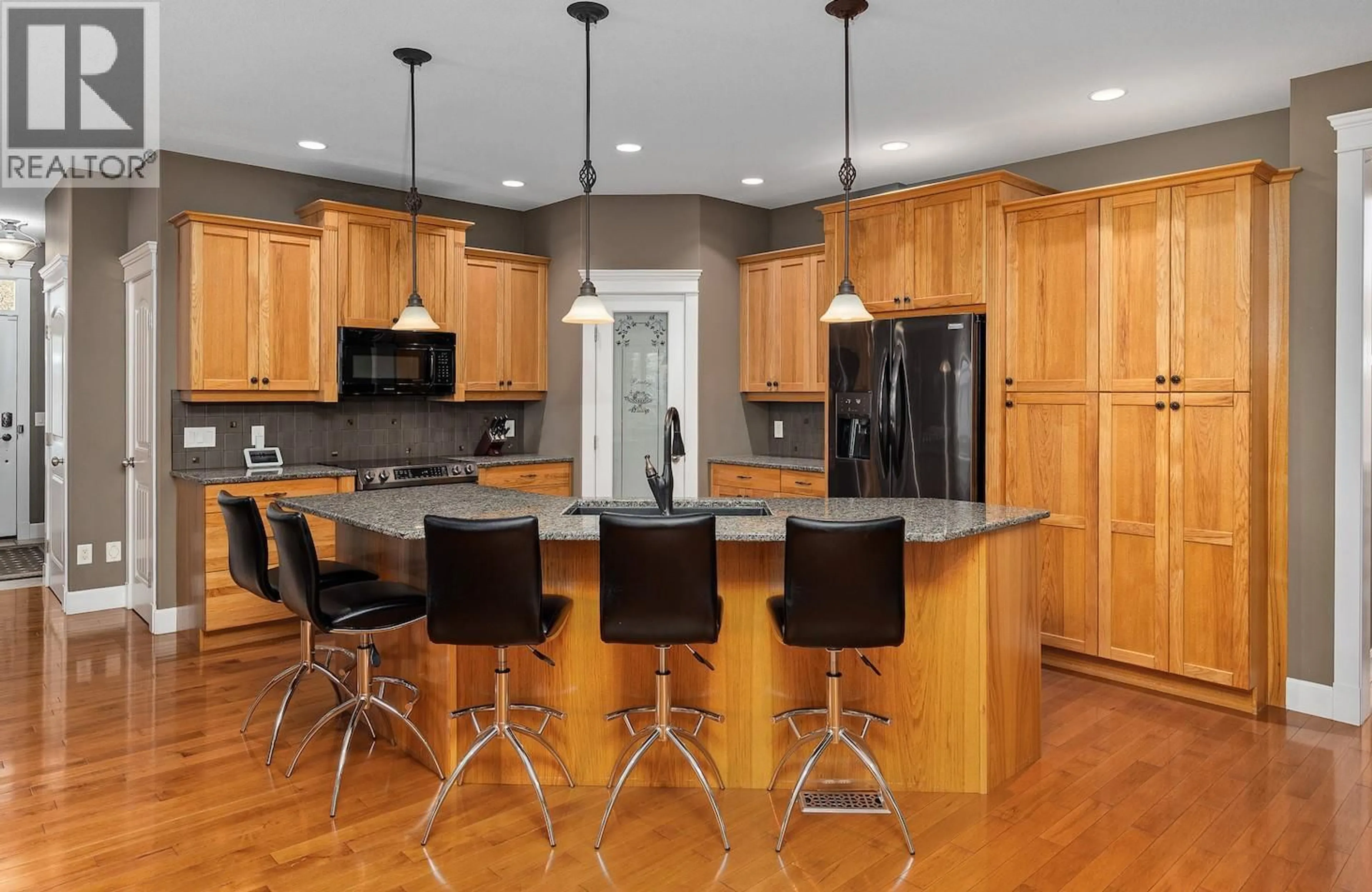 Contemporary kitchen, wood/laminate floor for 698 WESTPOINT COURT, Kelowna British Columbia V1W4Y3