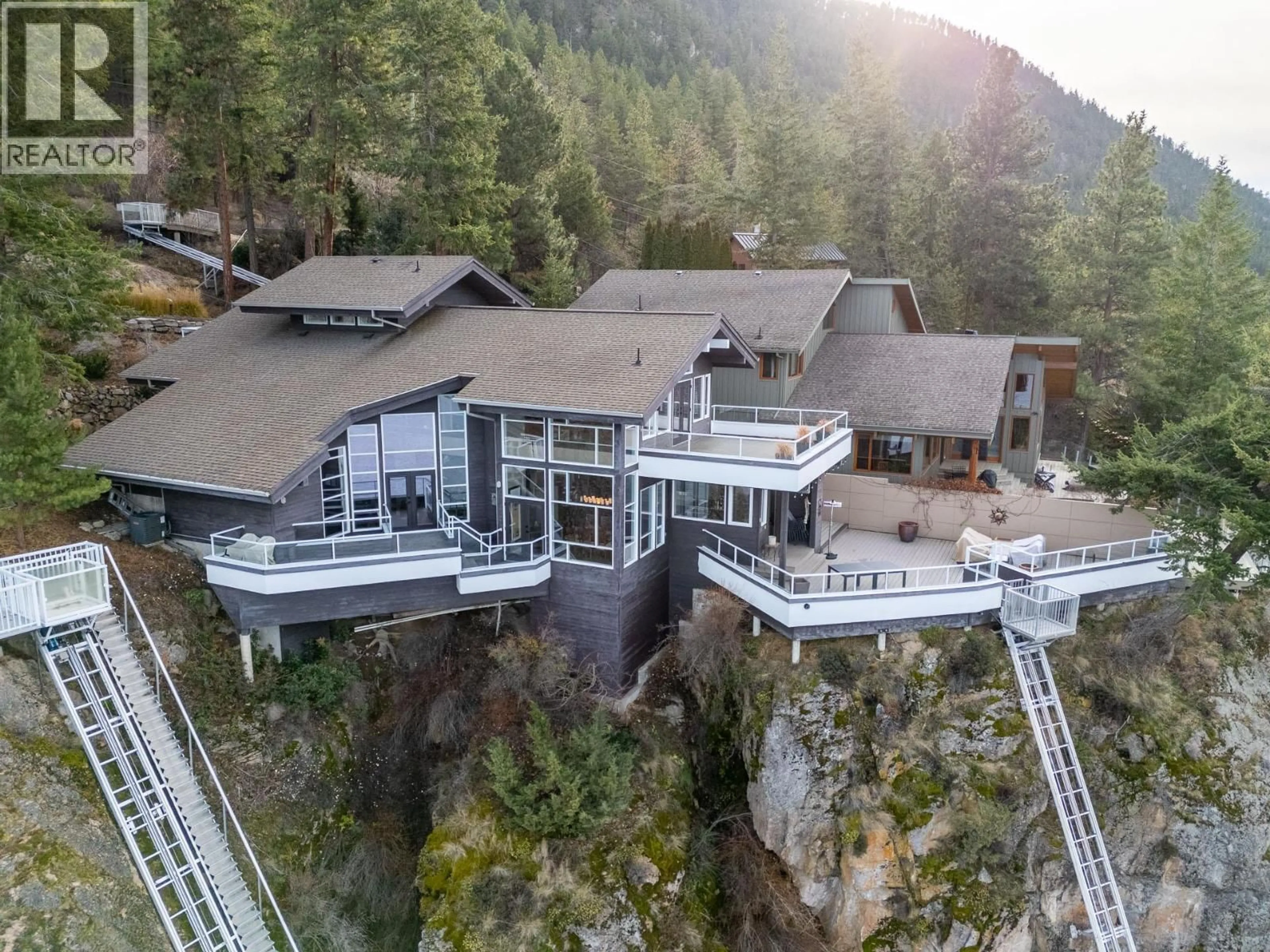 A pic from outside/outdoor area/front of a property/back of a property/a pic from drone, mountain view for 3 - 9900 EASTSIDE ROAD, Vernon British Columbia V1H1L6