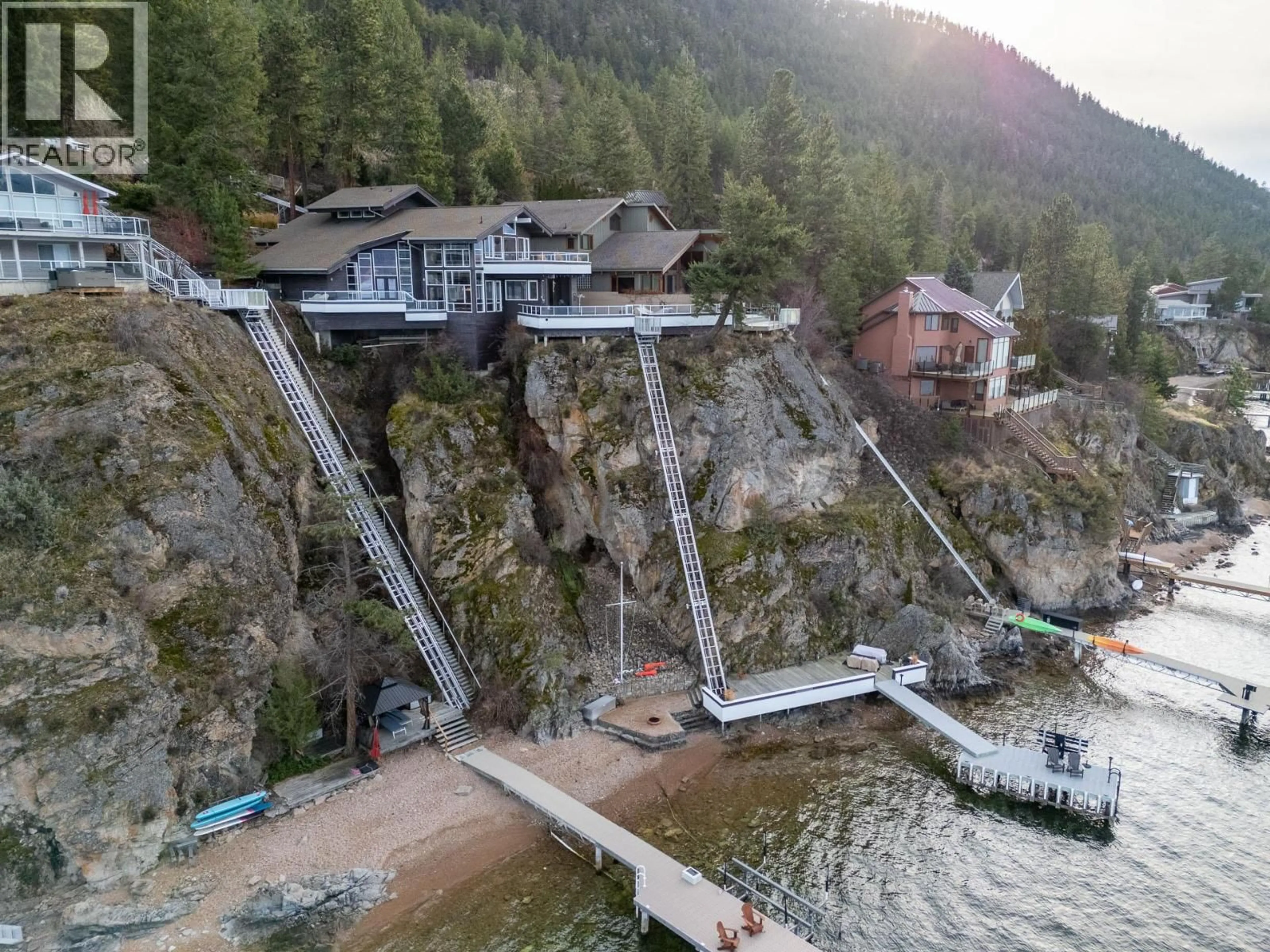 A pic from outside/outdoor area/front of a property/back of a property/a pic from drone, water/lake/river/ocean view for 3 - 9900 EASTSIDE ROAD, Vernon British Columbia V1H1L6