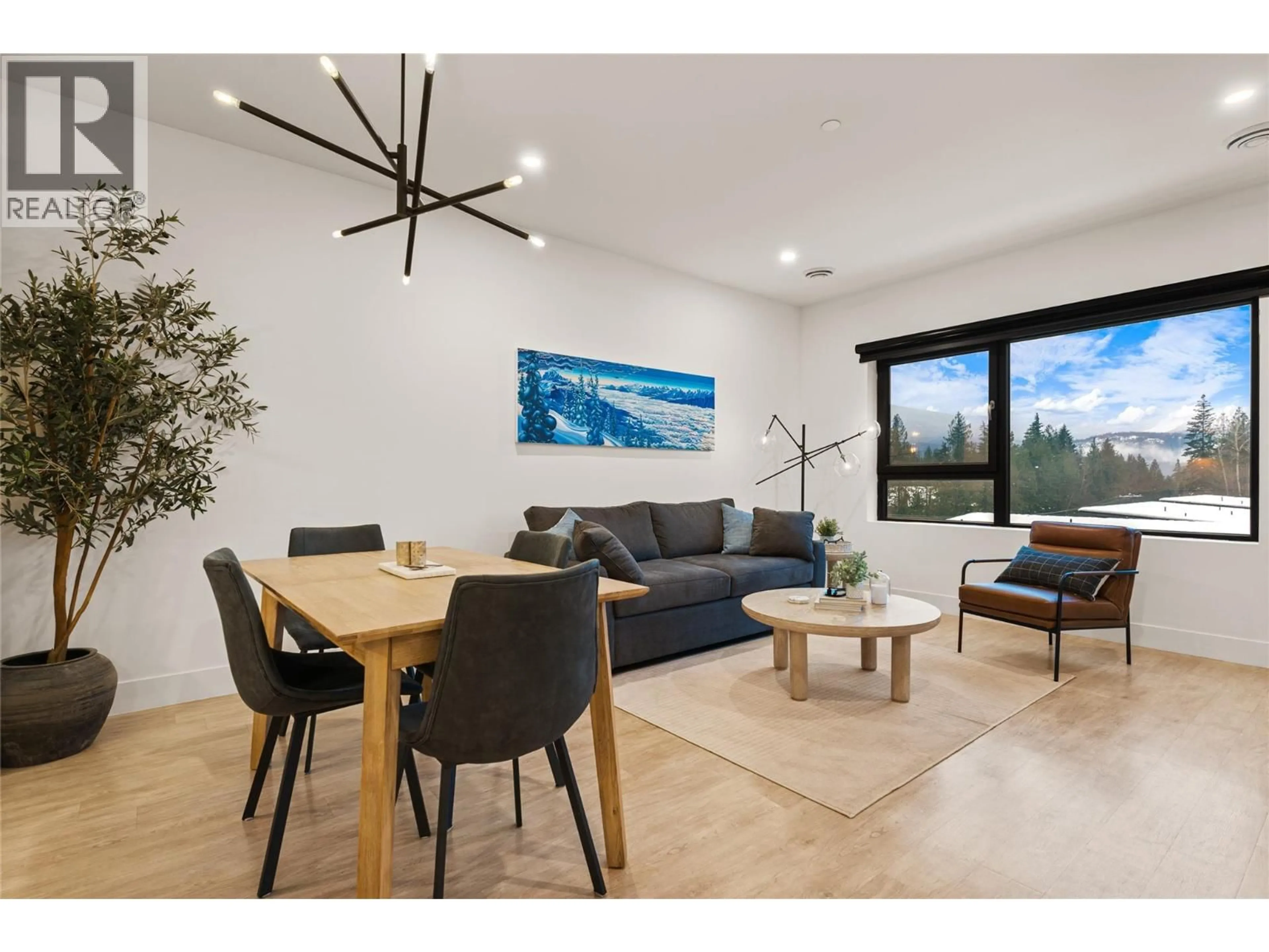 Living room with furniture, wood/laminate floor for 4403 - 1701 COURSIER AVENUE, Revelstoke British Columbia V0E2S3