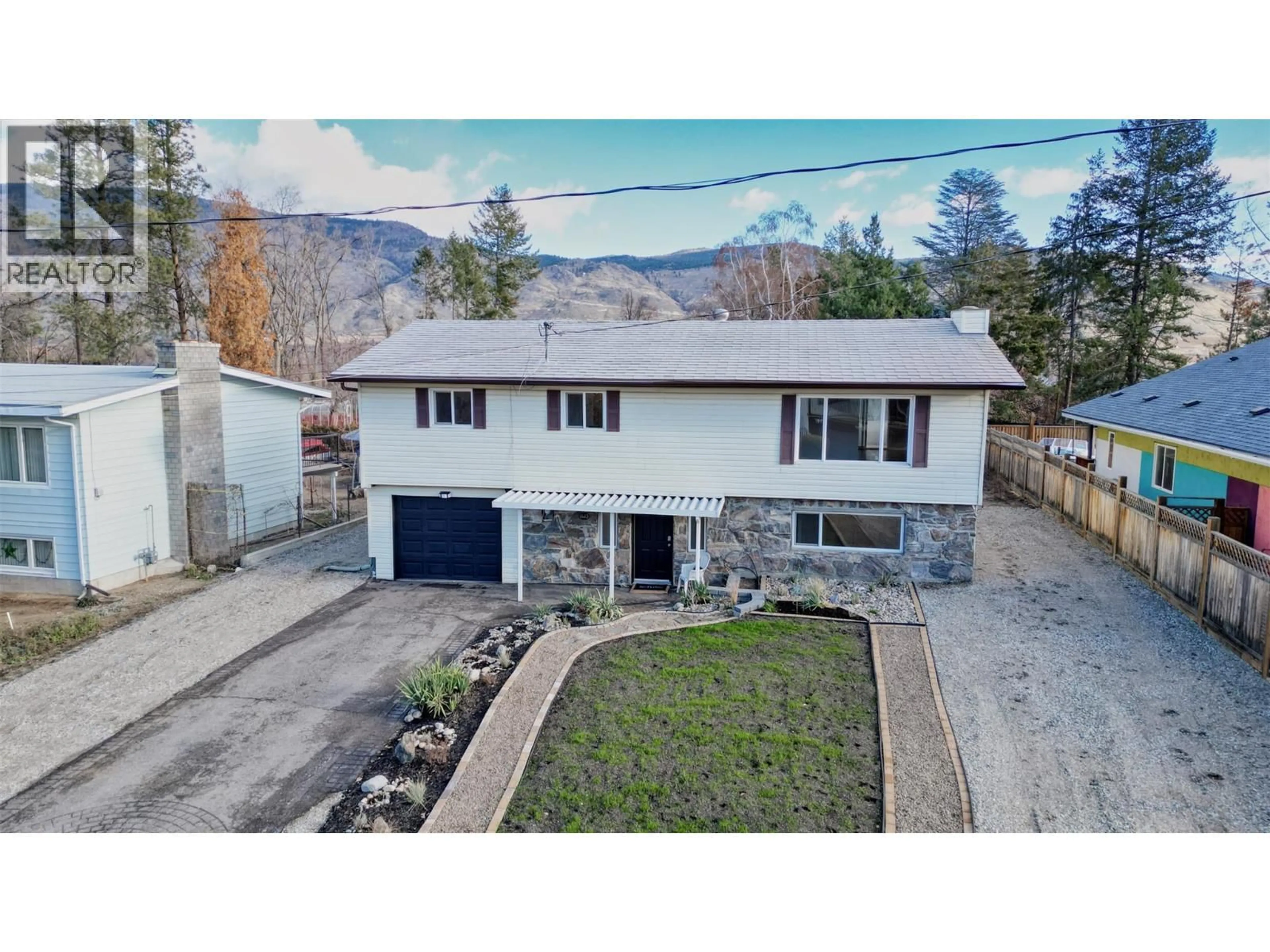 A pic from outside/outdoor area/front of a property/back of a property/a pic from drone, mountain view for 1415 91 STREET, Osoyoos British Columbia V0H1V1