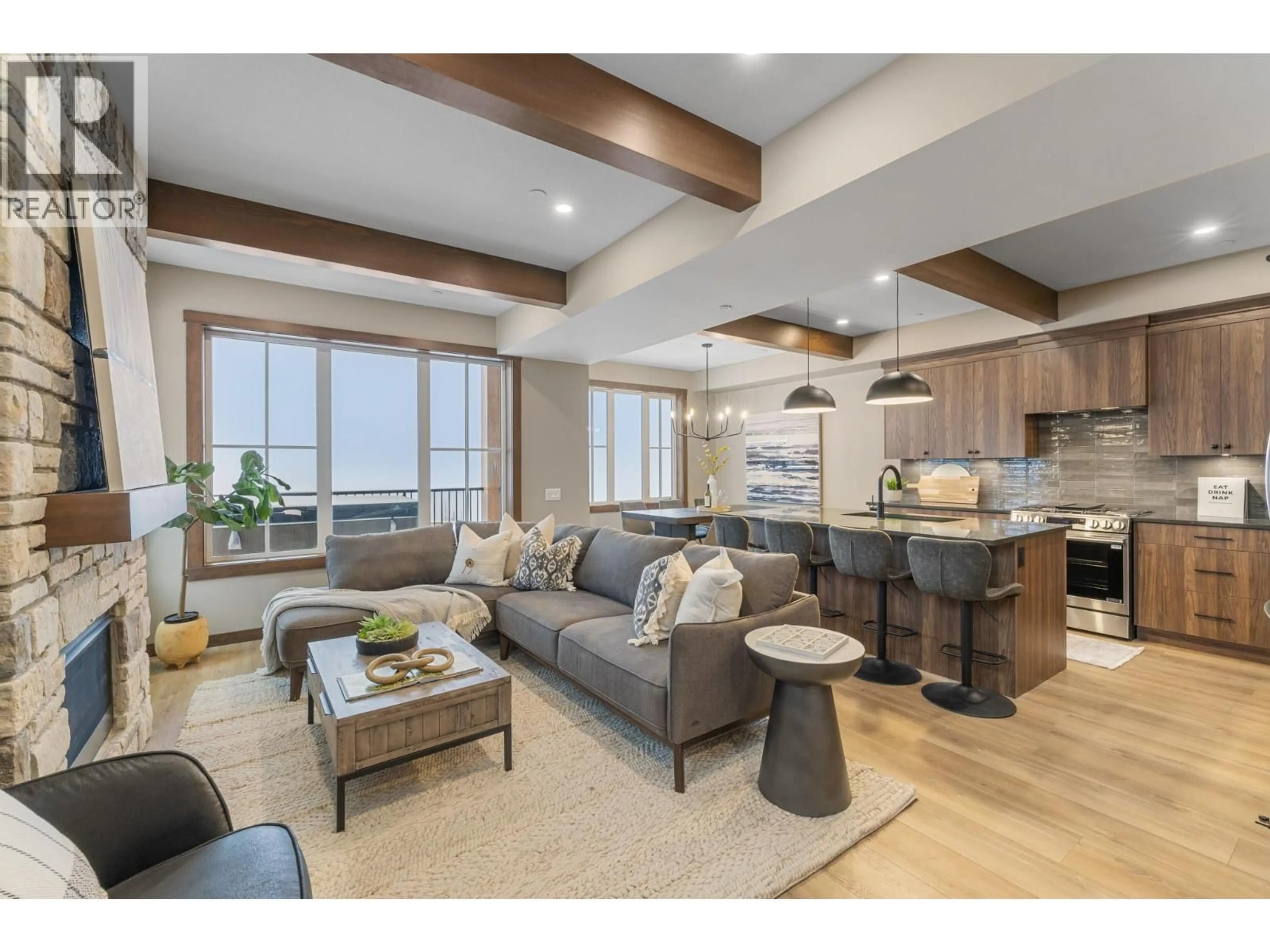 Living room with furniture, wood/laminate floor for 89 - 255 FEATHERTOP WAY, Big White British Columbia V1P1T4