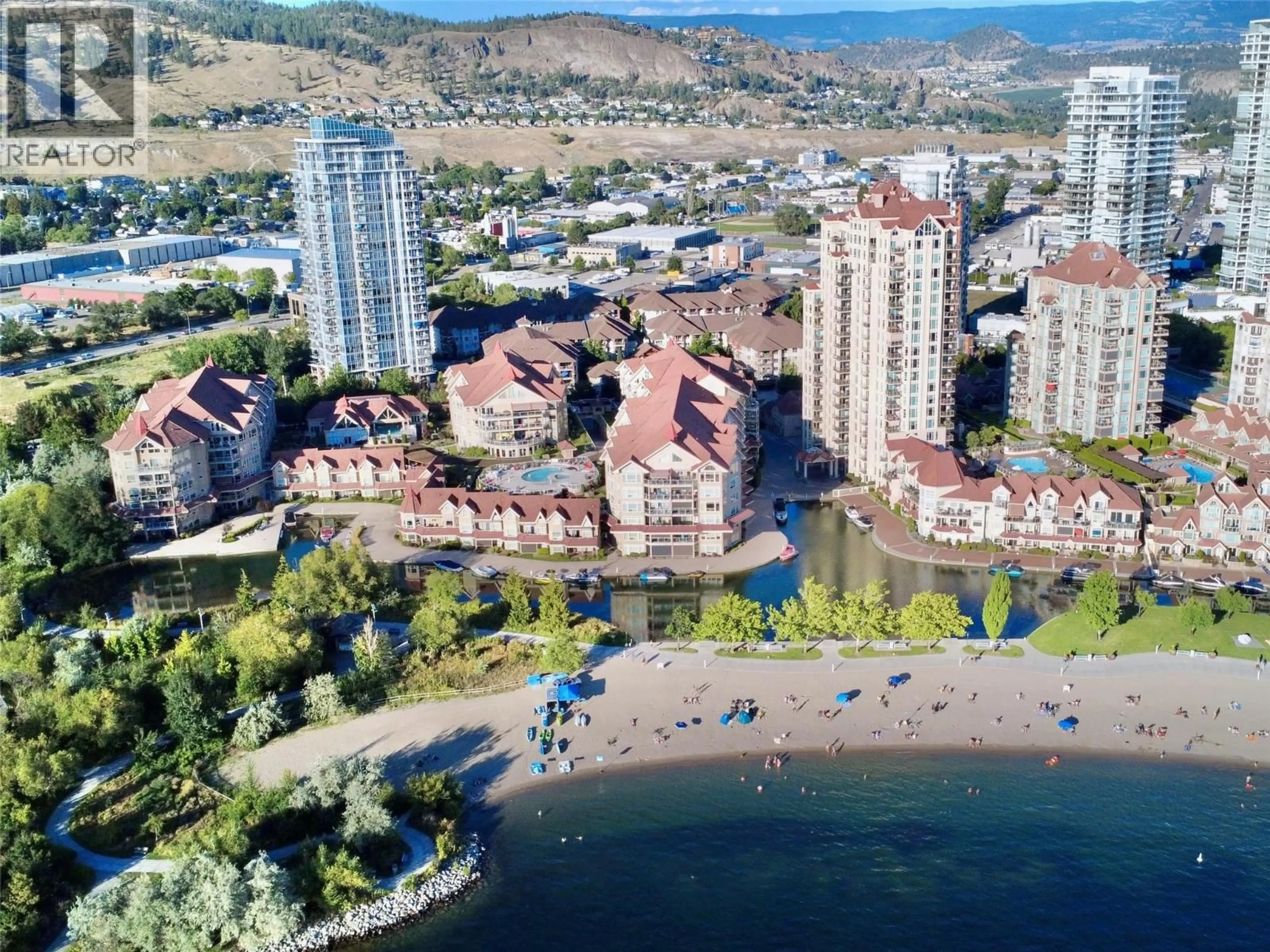 A pic from outside/outdoor area/front of a property/back of a property/a pic from drone, water/lake/river/ocean view for 105 - 1093 SUNSET DRIVE, Kelowna British Columbia V1Y9Z4