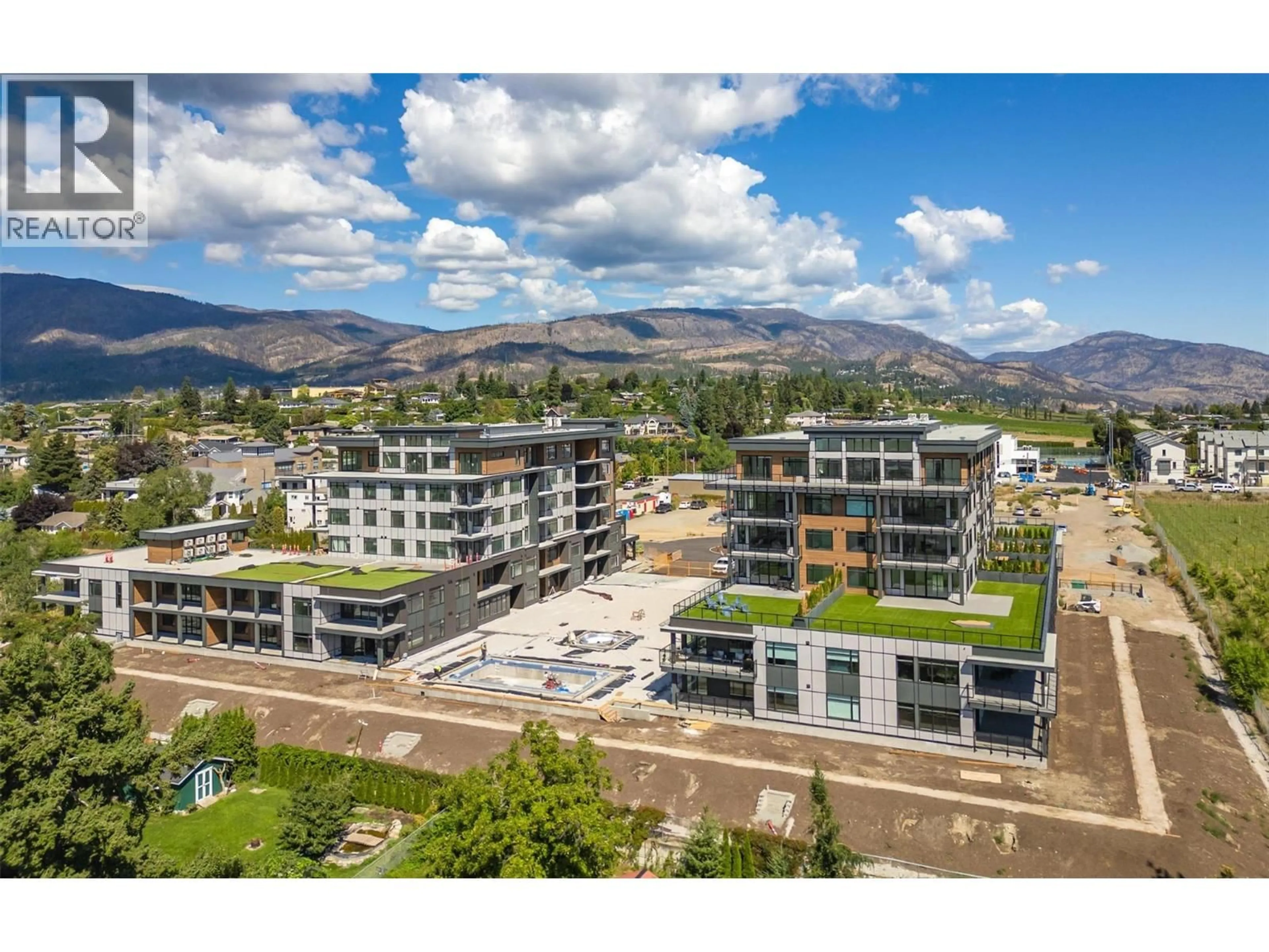 A pic from outside/outdoor area/front of a property/back of a property/a pic from drone, mountain view for 501 - 2760 OLALLA ROAD, West Kelowna British Columbia V1Z2A9