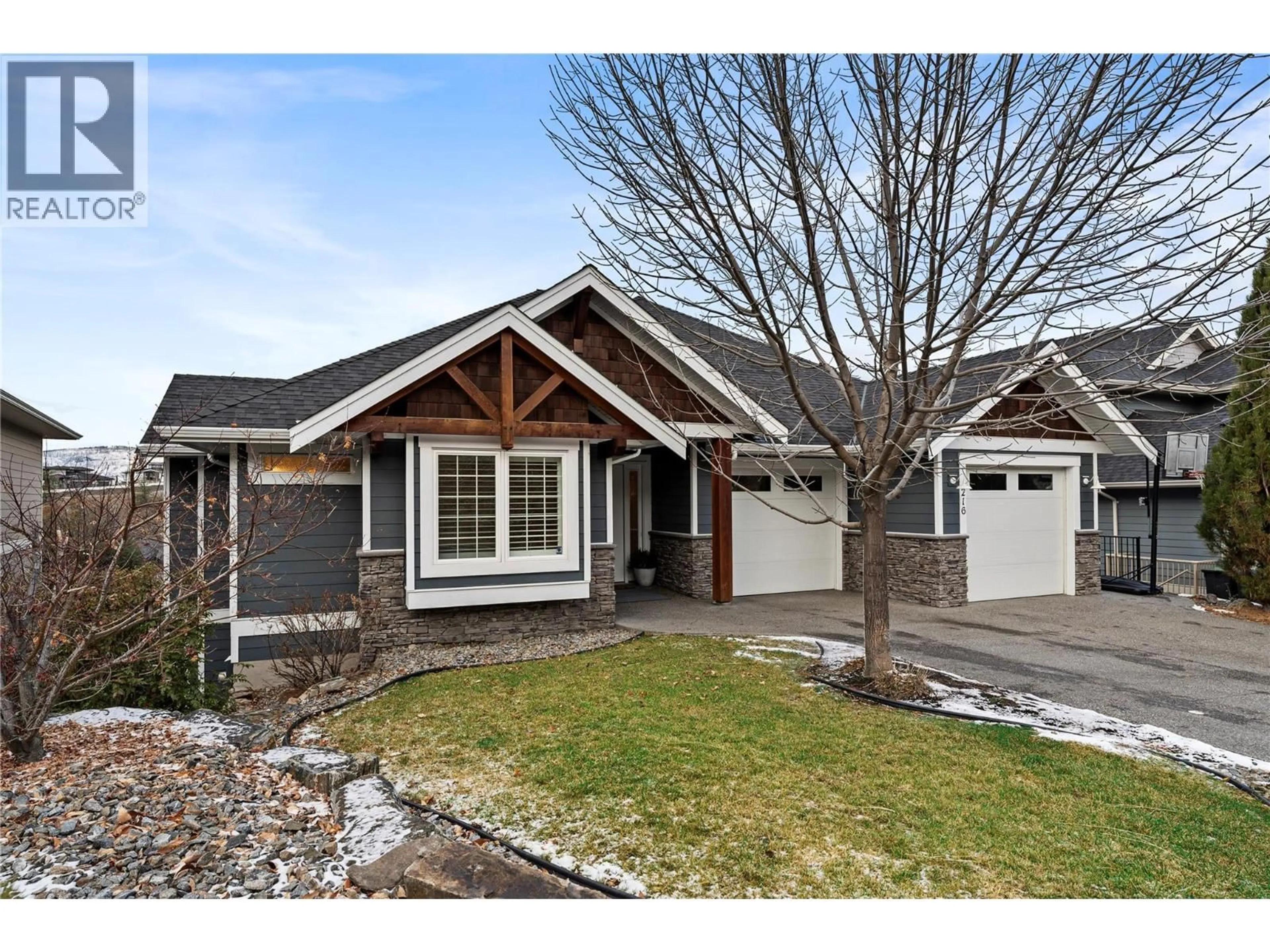 Home with vinyl exterior material, street for 216 LOST CREEK LANE, Kelowna British Columbia V1V3B6