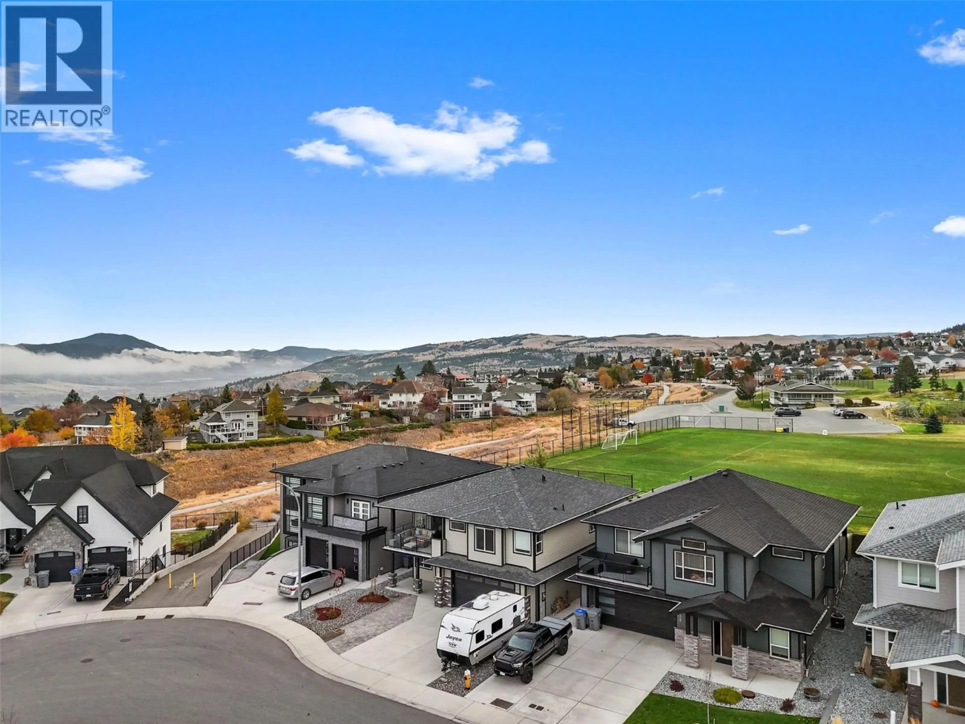 A pic from outside/outdoor area/front of a property/back of a property/a pic from drone, mountain view for 1332 KINROSS PLACE, Kamloops British Columbia V1S0B8