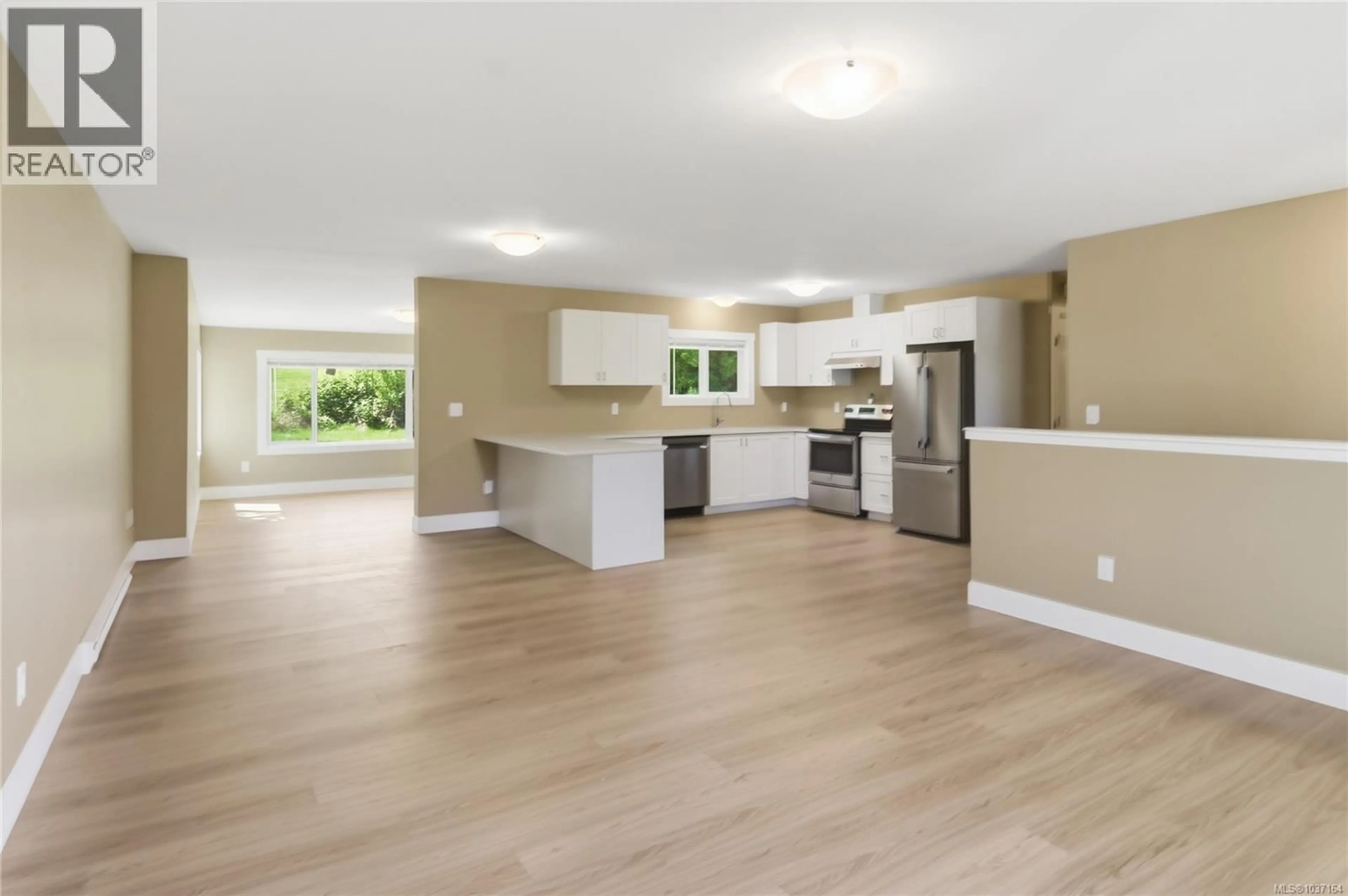 Open concept kitchen, wood/laminate floor for 1965 STANNARD DRIVE, Nanaimo British Columbia V9X1B4