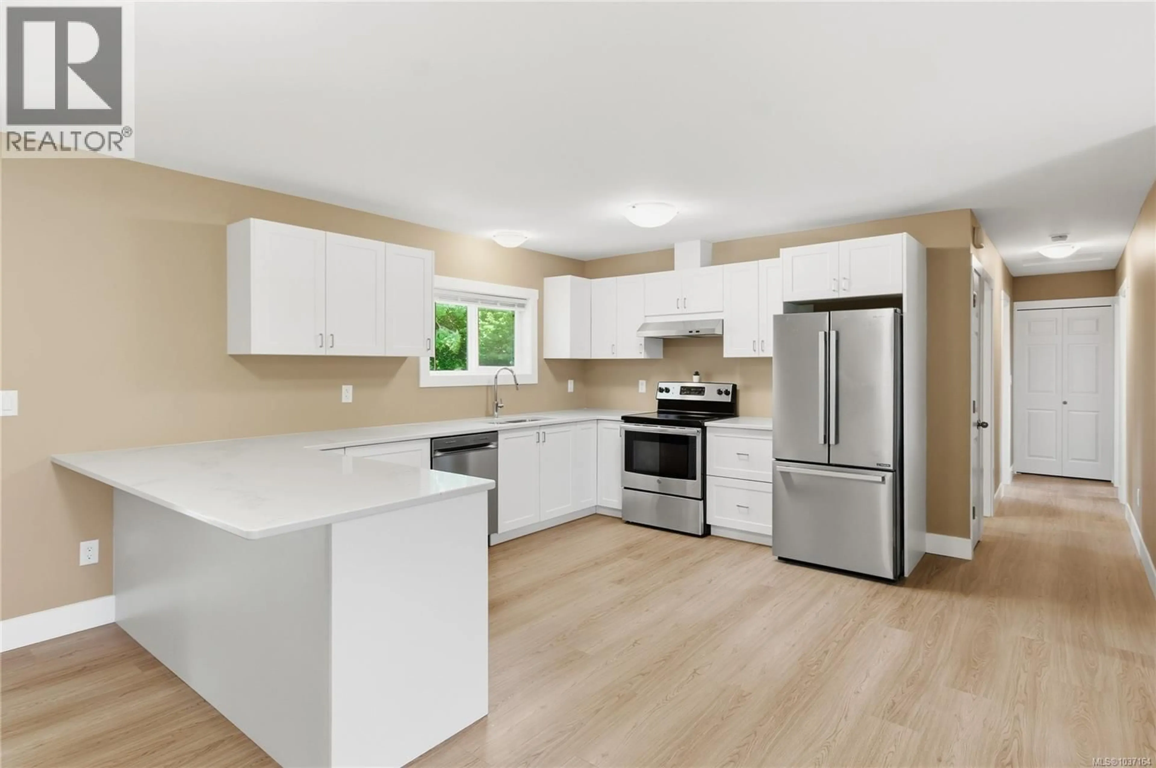 Open concept kitchen, wood/laminate floor for 1965 STANNARD DRIVE, Nanaimo British Columbia V9X1B4