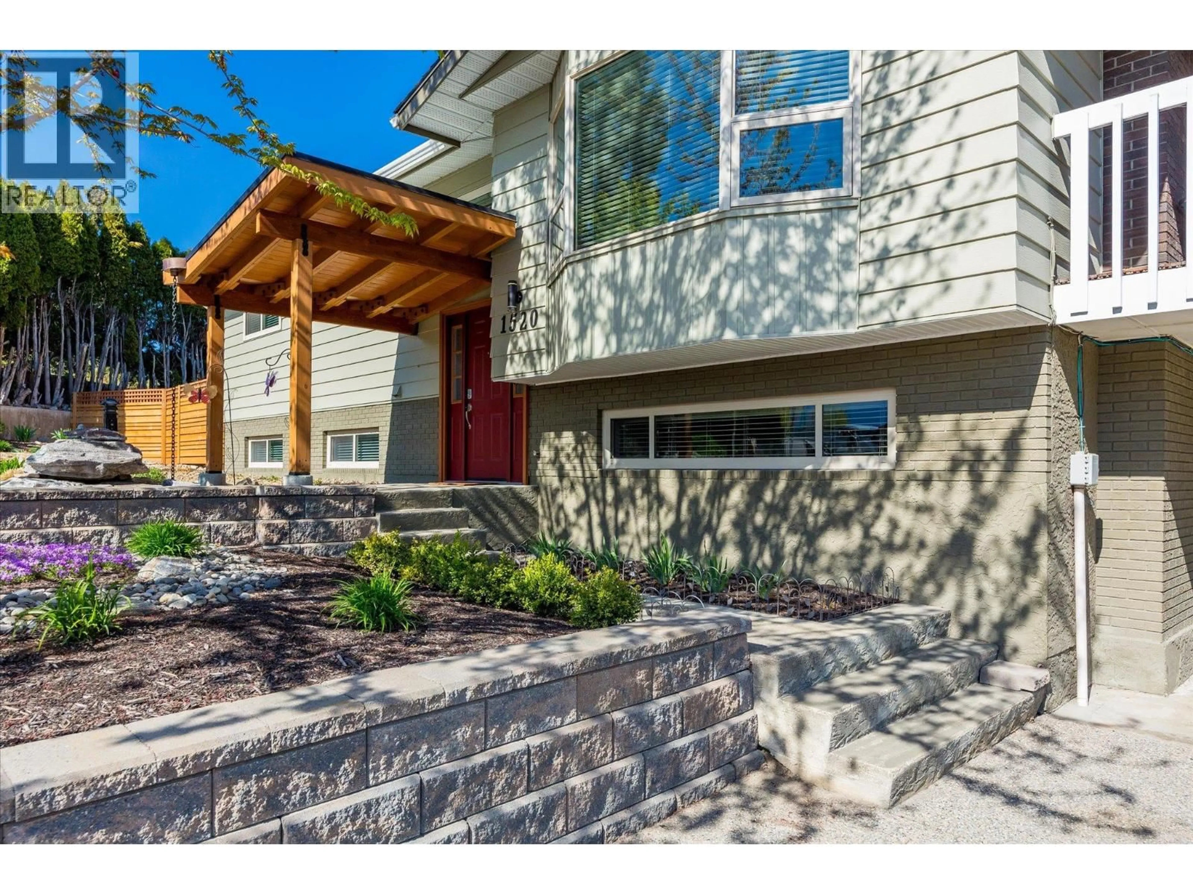 Home with brick exterior material, street for 1520 HIGHLAND DRIVE NORTH, Kelowna British Columbia V1Y4K5