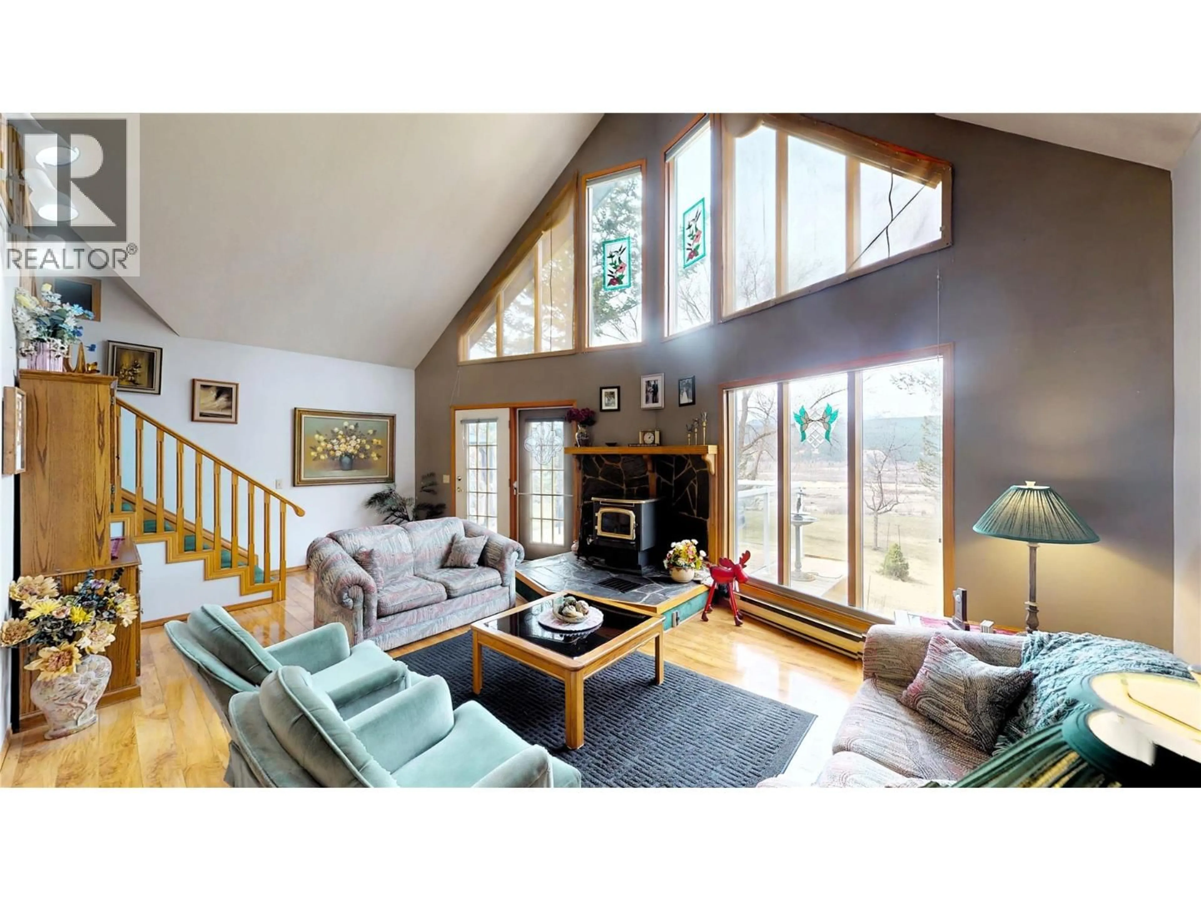 Living room with furniture, wood/laminate floor for 7319 GLACIER DRIVE, Radium Hot Springs British Columbia V0A1M0